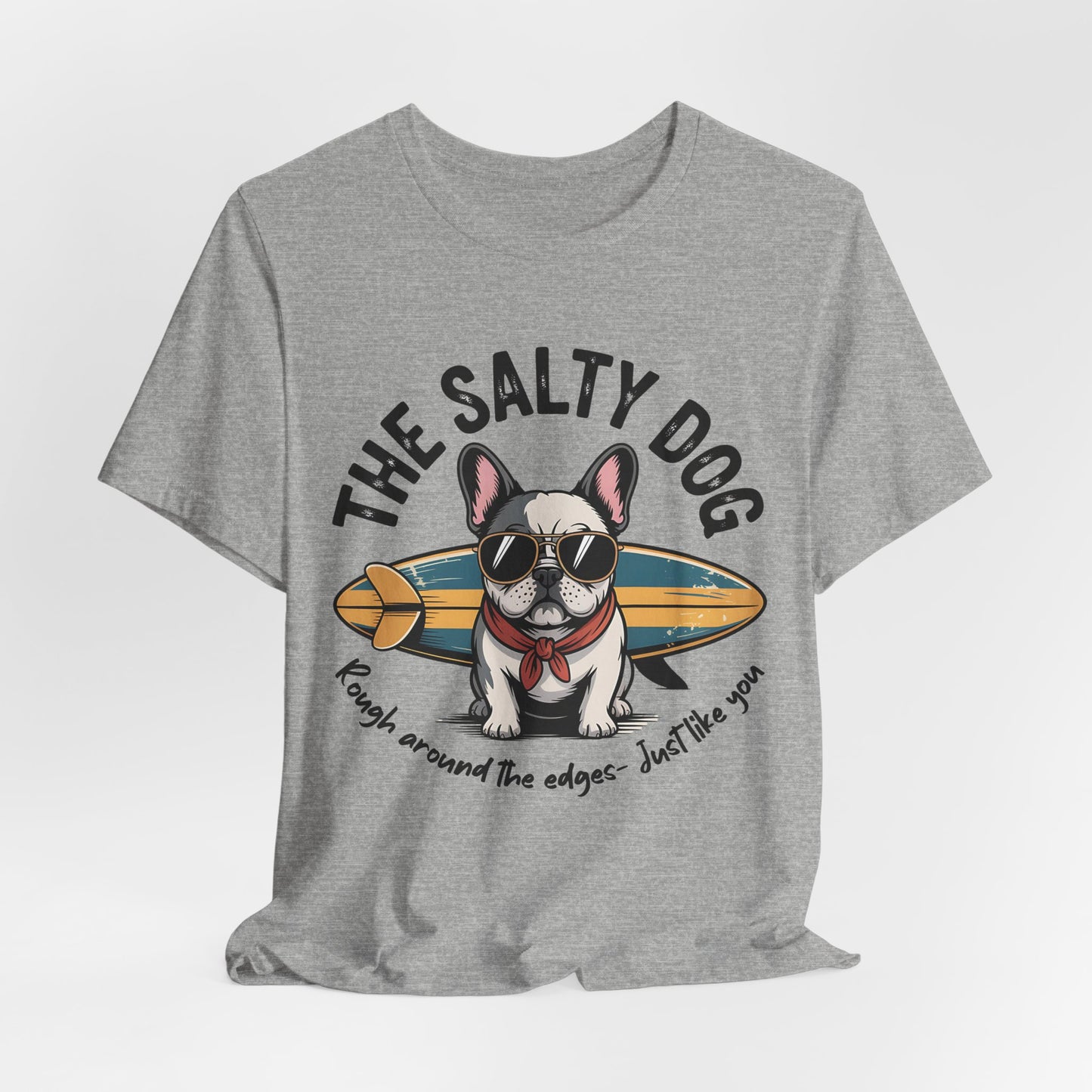 The Salty Dog Unisex Surf T-Shirt: gray tee with a French Bulldog in sunglasses and red scarf, posing with a surfboard and THE SALTY DOG text. Great for beach days—rugged style for anyone who loves the coast.