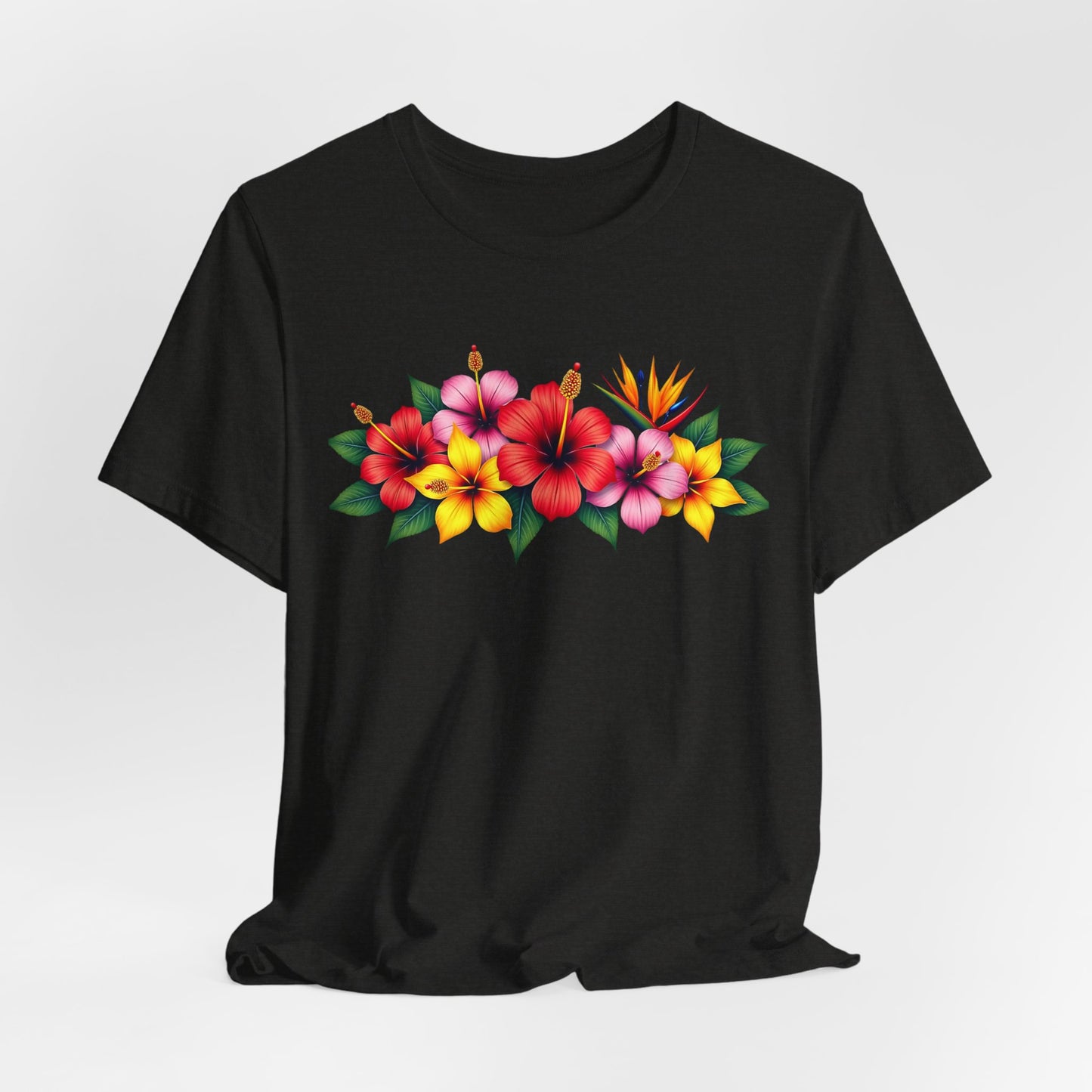 The Tropical Floral Unisex T-Shirt – Bright & Vibrant Summer Shirt features red, pink, and yellow hibiscus flowers with green leaves on black fabric, adding a bohemian touch to your outfit.
