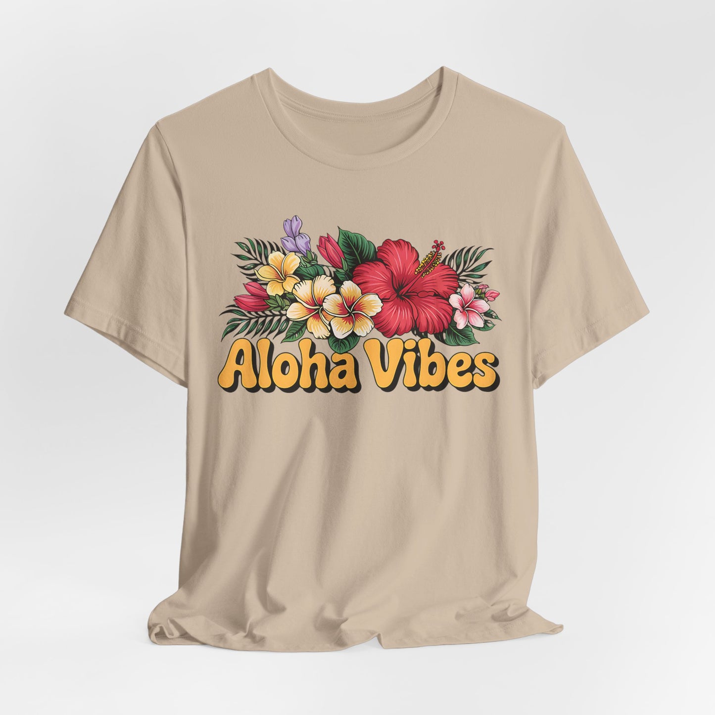 The Aloha Vibes Floral Unisex T-Shirt for Island Vibes features a vibrant tropical flower and leaf design with bold yellow Aloha Vibes text on the front, made from breathable jersey fabric for all-day comfort.