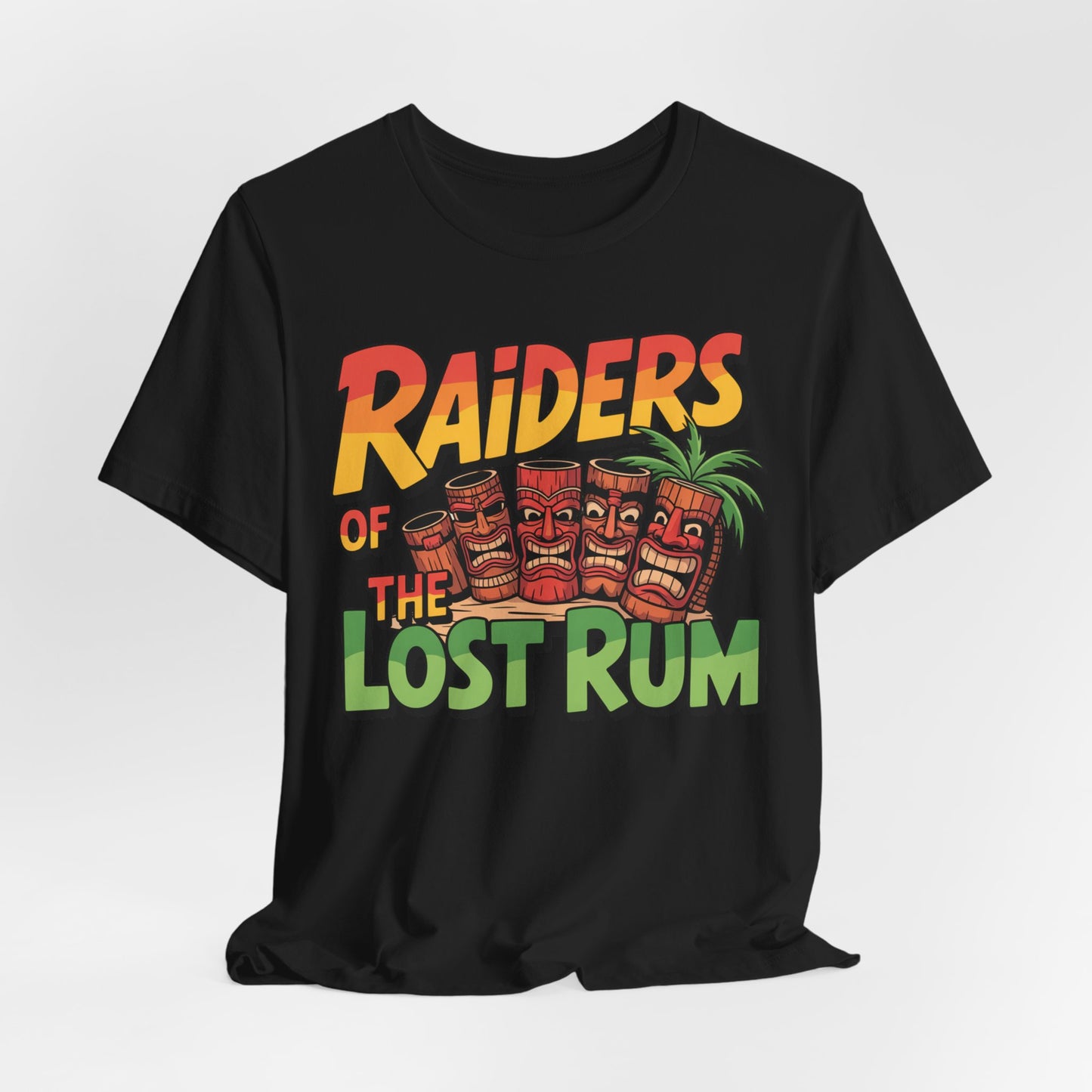 The Tiki T-Shirt - Raiders of the Lost Rum Graphic Tee for Adventure Lovers features colorful Raiders of the Lost Rum text, three tiki mugs with faces, and a palm tree—perfect summer style for festivals.
