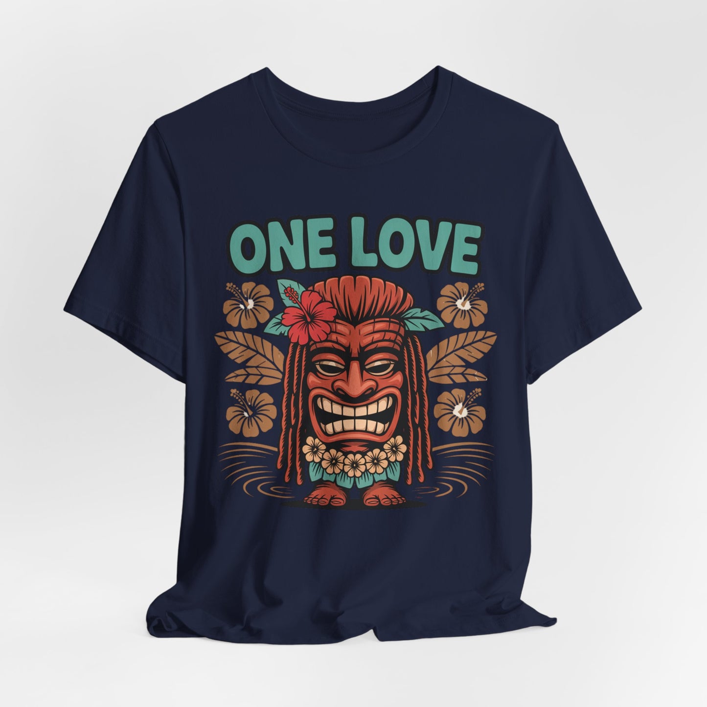 The One Love Tropical Unisex Jersey Tiki T-Shirt is a navy blue tee with a vibrant tiki mask, tropical flowers, and bold green ONE LOVE text—perfect for anyone who loves beach vibes or festivals.