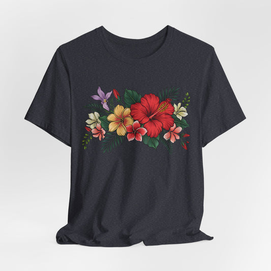 The Tropical Floral Unisex T-Shirt - Vibrant Summer Style features a dark base with a vivid floral print of red, yellow, and white hibiscus flowers and green leaves on soft Airlume cotton.