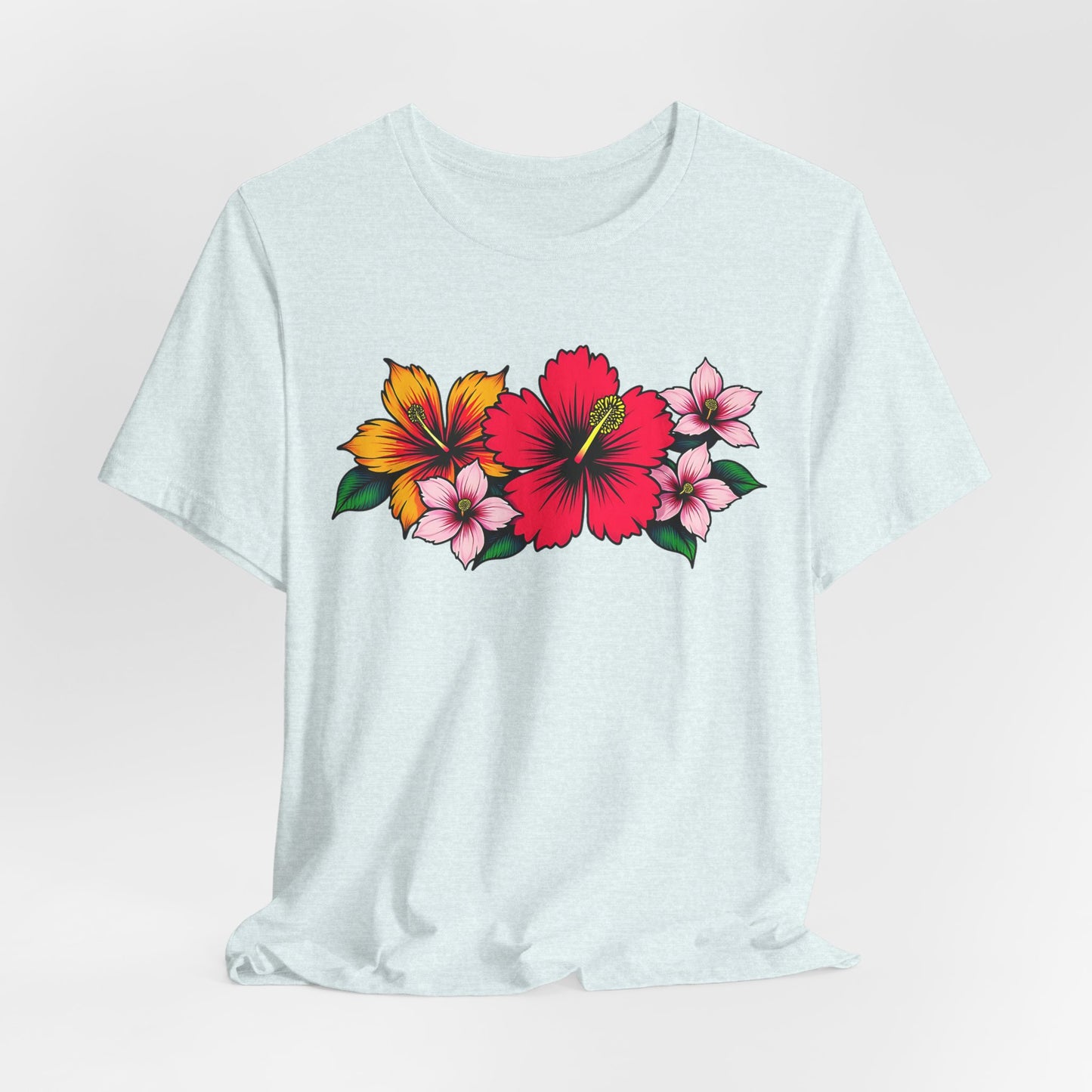 The Tropical Floral Unisex Jersey T-Shirt features vibrant floral designs—large red and yellow hibiscus with small pink flowers—making it perfect for summer beach days or casual gatherings.