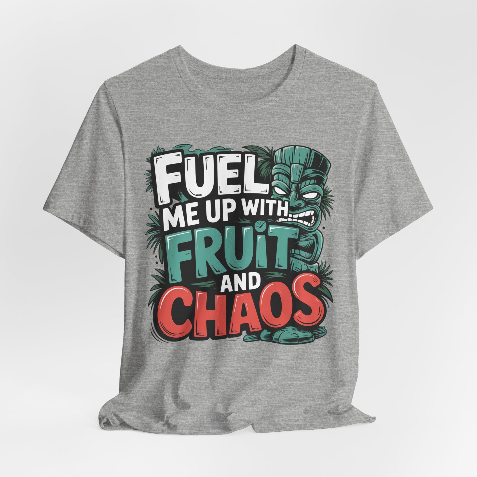 The Fuel Me Up With Fruit and Chaos Unisex Jersey Tiki T-Shirt is a gray tee with a colorful tiki mask and bold text, perfect for summer adventures and anyone who loves fun, playful style.