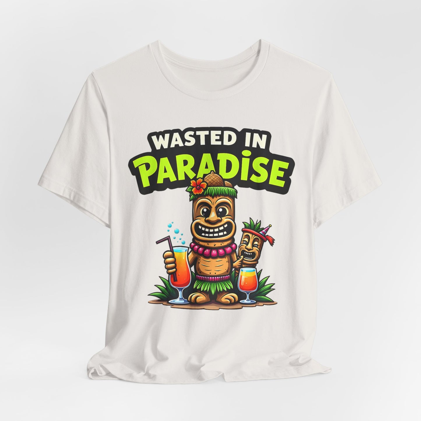 The Wasted in Paradise Graphic Tiki T-Shirt is a unisex jersey featuring cartoon tiki characters with drinks, grass skirts, and flowers. Wasted in Paradise is boldly printed above, perfect for beach lovers and vacation style.