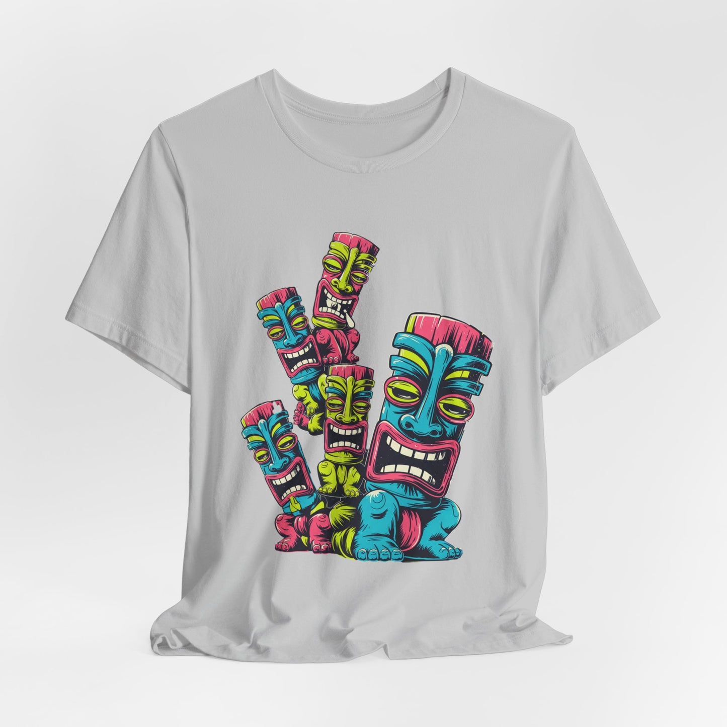 The Vibrant Tiki Art Unisex Jersey Tiki T-Shirt features a vibrant graphic of five expressive tiki masks with bold outlines, printed in full color using high-quality DTG techniques for a fun, casual look.