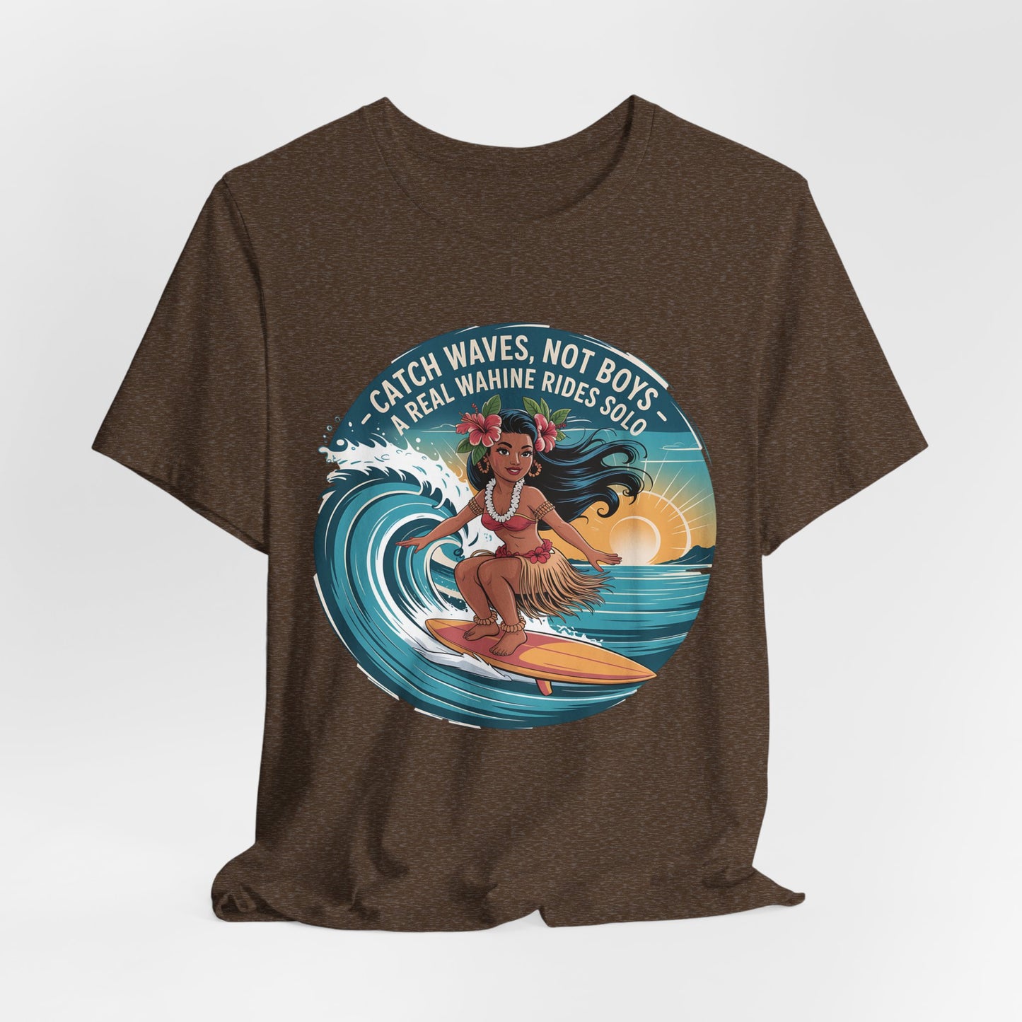 The Catch Waves Not Boys Wahine T-Shirt features a graphic of a surfing woman at sunset, wearing a flower crown and grass skirt, with the phrase: Catch waves, not boys. A real wahine rides solo.” Perfect for beach lovers.
