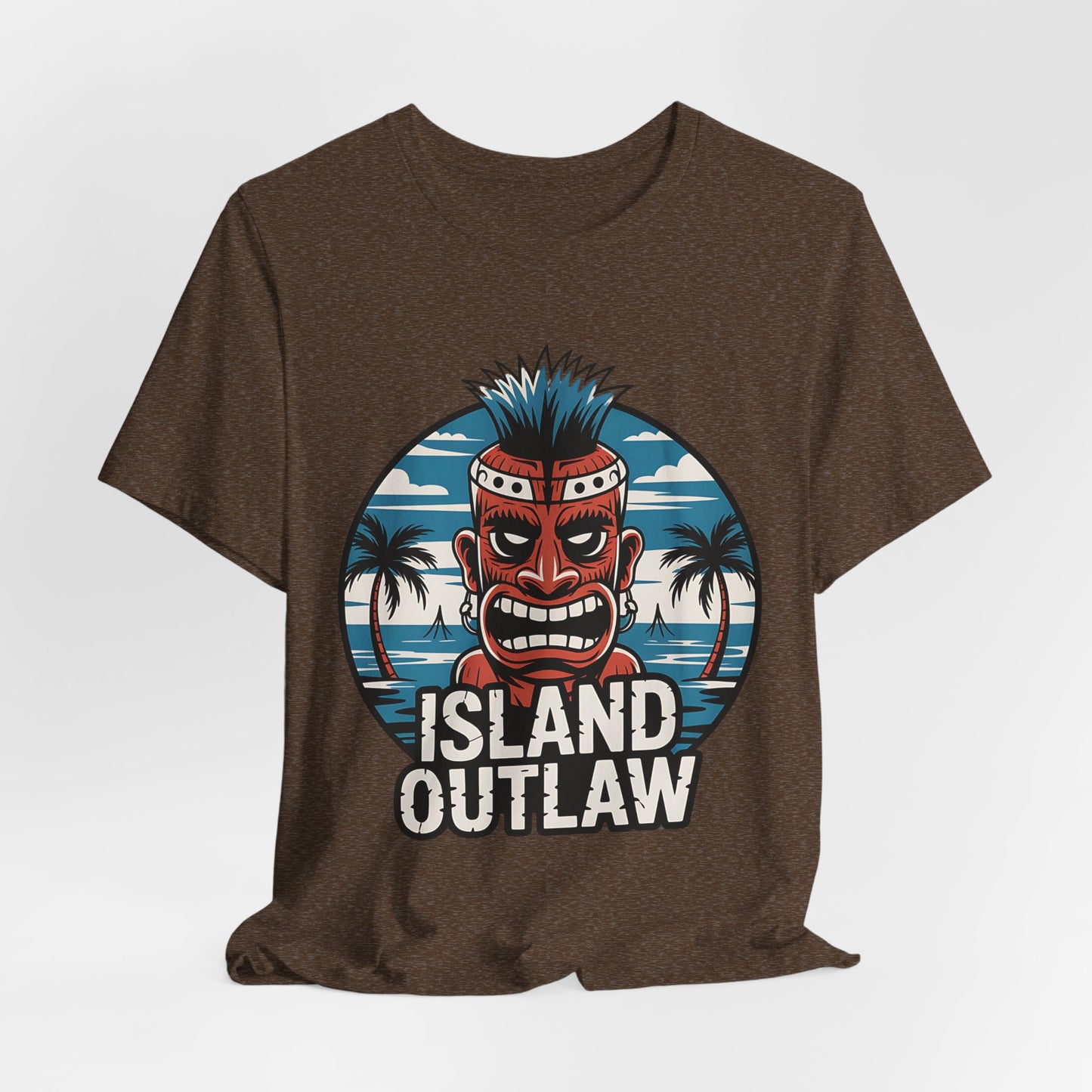The Island Outlaw Tiki T-Shirt - Unisex Jersey Tee for Tropical Vibes features a red tiki mask with blue spiked hair, palm trees, and ocean, plus ISLAND OUTLAW in bold white letters—ideal for beach outings and getaways.