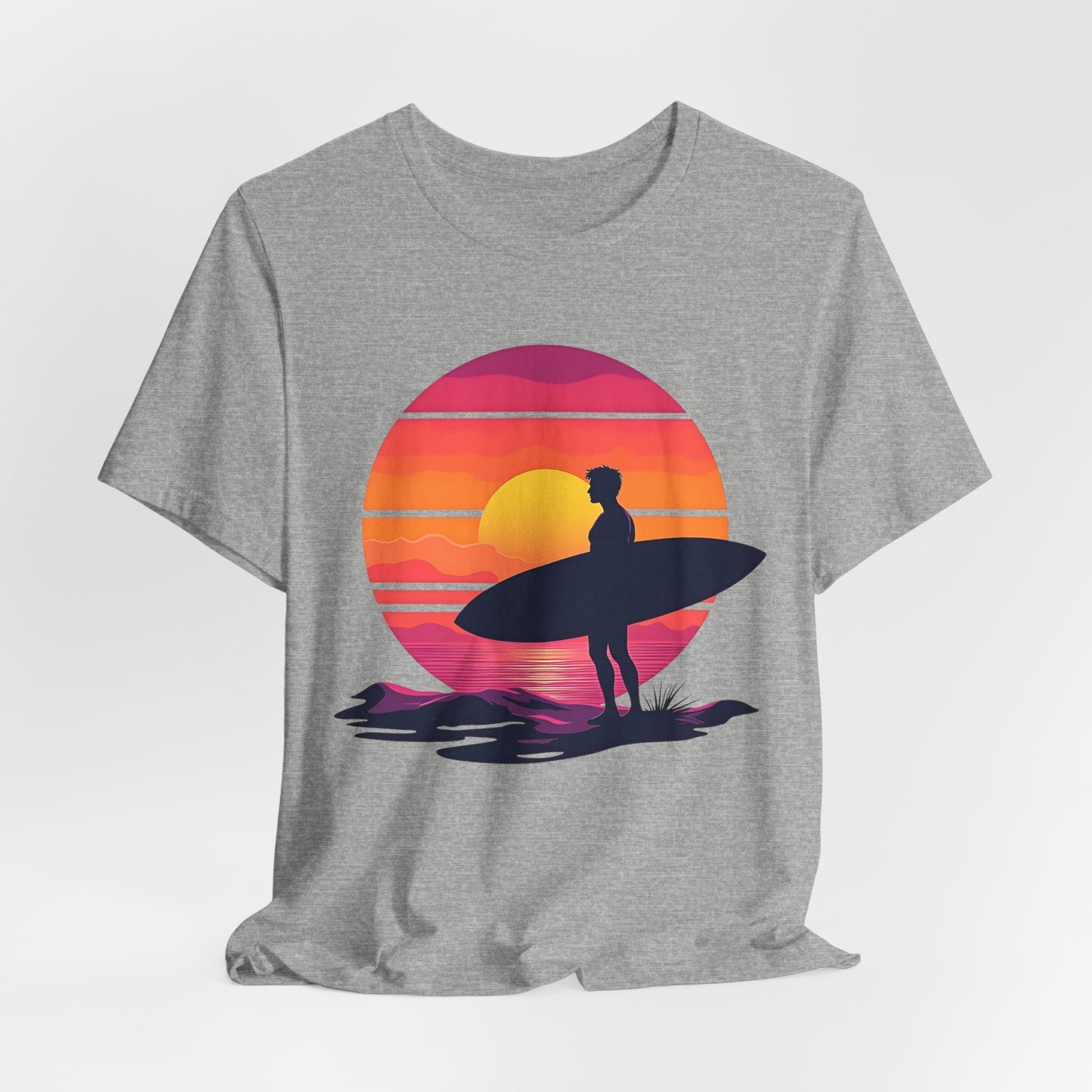 The Sunset Surfing Unisex Jersey T-Shirt features a vivid DTG-printed graphic of a surfer with a surfboard at sunset—an ideal choice for beach lovers.