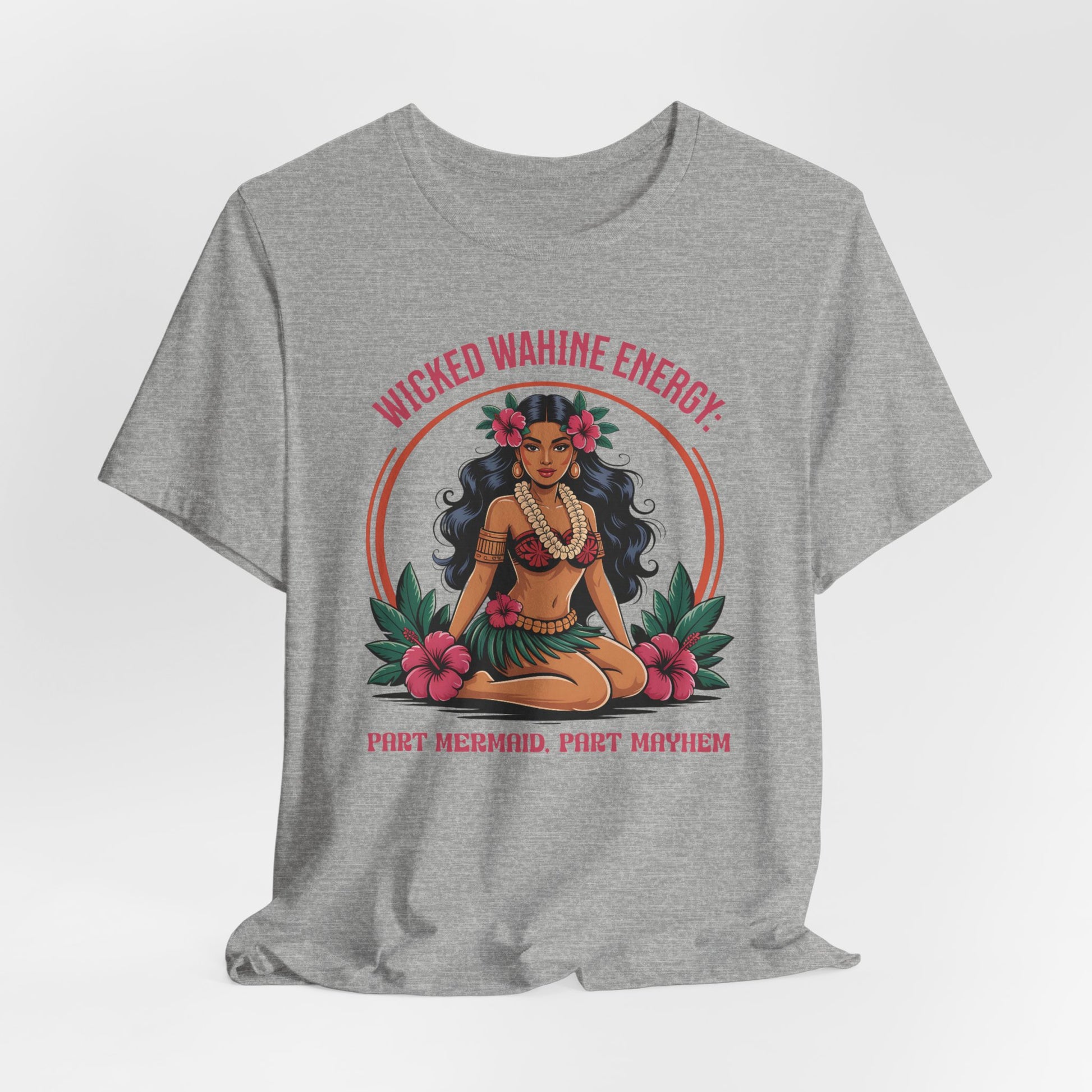 The Wicked Wahine Energy Unisex Tee – Part Mermaid, Part Mayhem is a gray shirt featuring an illustrated woman with a mermaid tail, tropical leaves, and flowers—perfect for fantasy lovers.