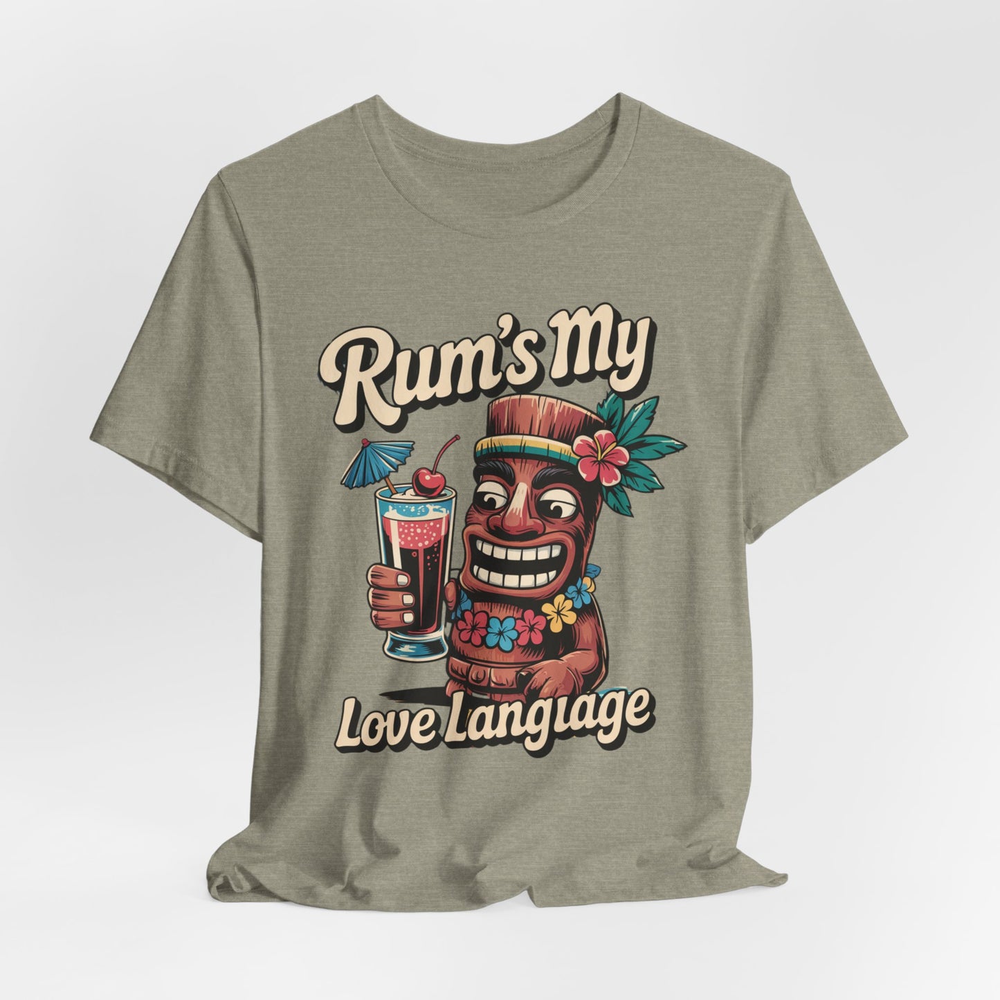 The Tropical Rum Themed Tiki T-Shirt - Rums My Love Language Unisex Jersey Short Sleeve Tee features a smiling tiki with a cocktail, flowers, and fruit, plus “Rums My” above and “Love Language” below—ideal for tropical celebrations.
