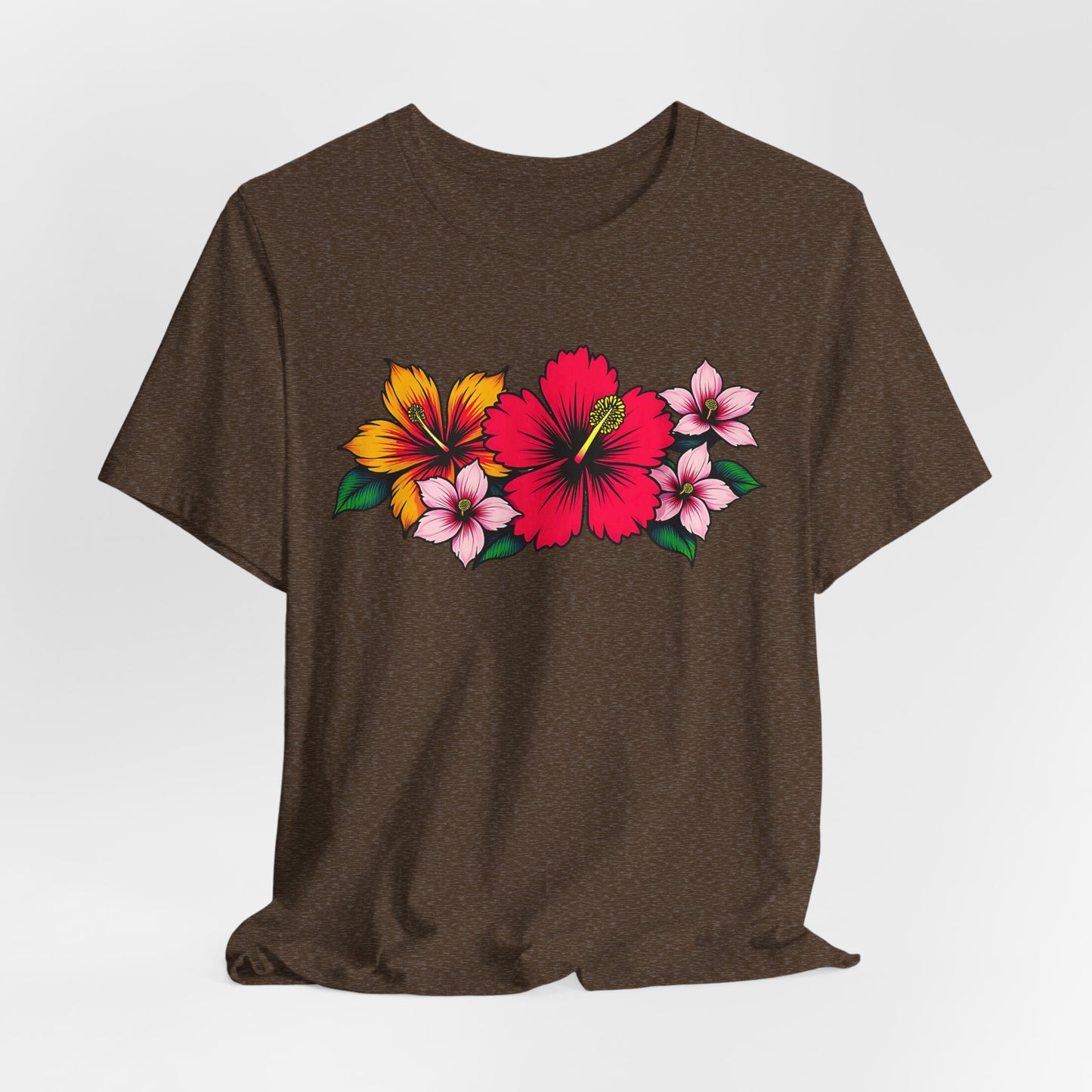 The Tropical Floral Unisex Jersey T-Shirt boasts vibrant floral designs with a standout red hibiscus, plus yellow and pink flowers with green leaves—ideal for summer and beach days.
