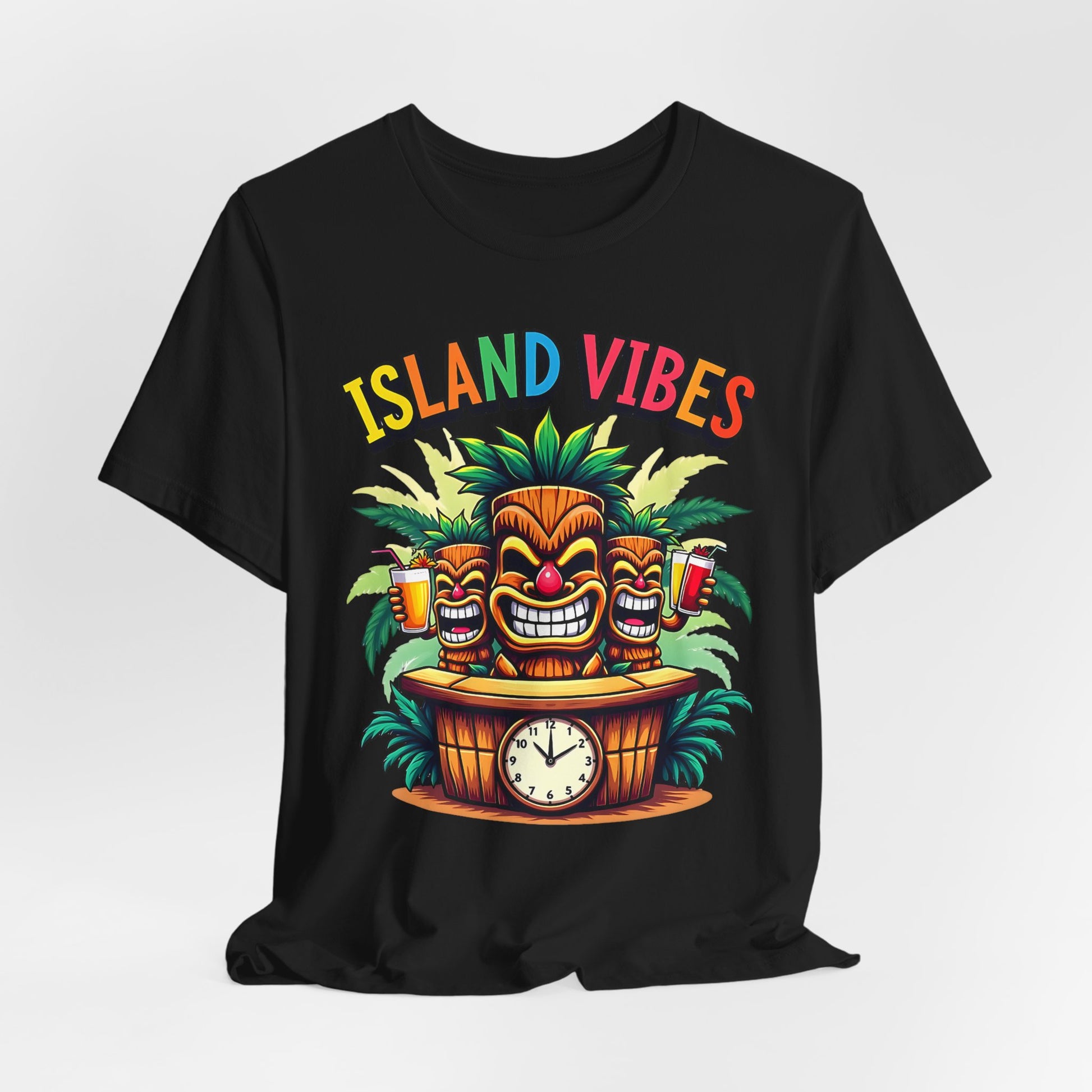 The Island Vibes Tiki T-Shirt – Unisex Relaxed Fit features three colorful tiki faces with drinks, tropical leaves, and a wooden bar clock. “ISLAND VIBES” in rainbow letters—perfect for tropical and beach lovers.