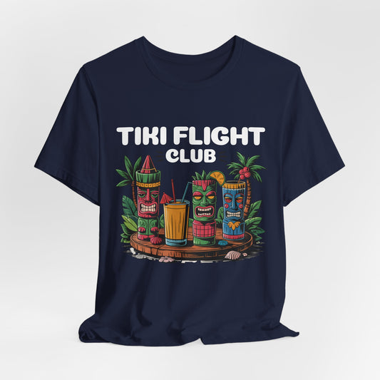 The Tiki Flight Club Graphic Tiki T-Shirt - Unisex Summer Vibe T-Shirt features three colorful tiki statues, tropical plants, and drinks under bold white text—perfect for a casual beach day or summer outing.
