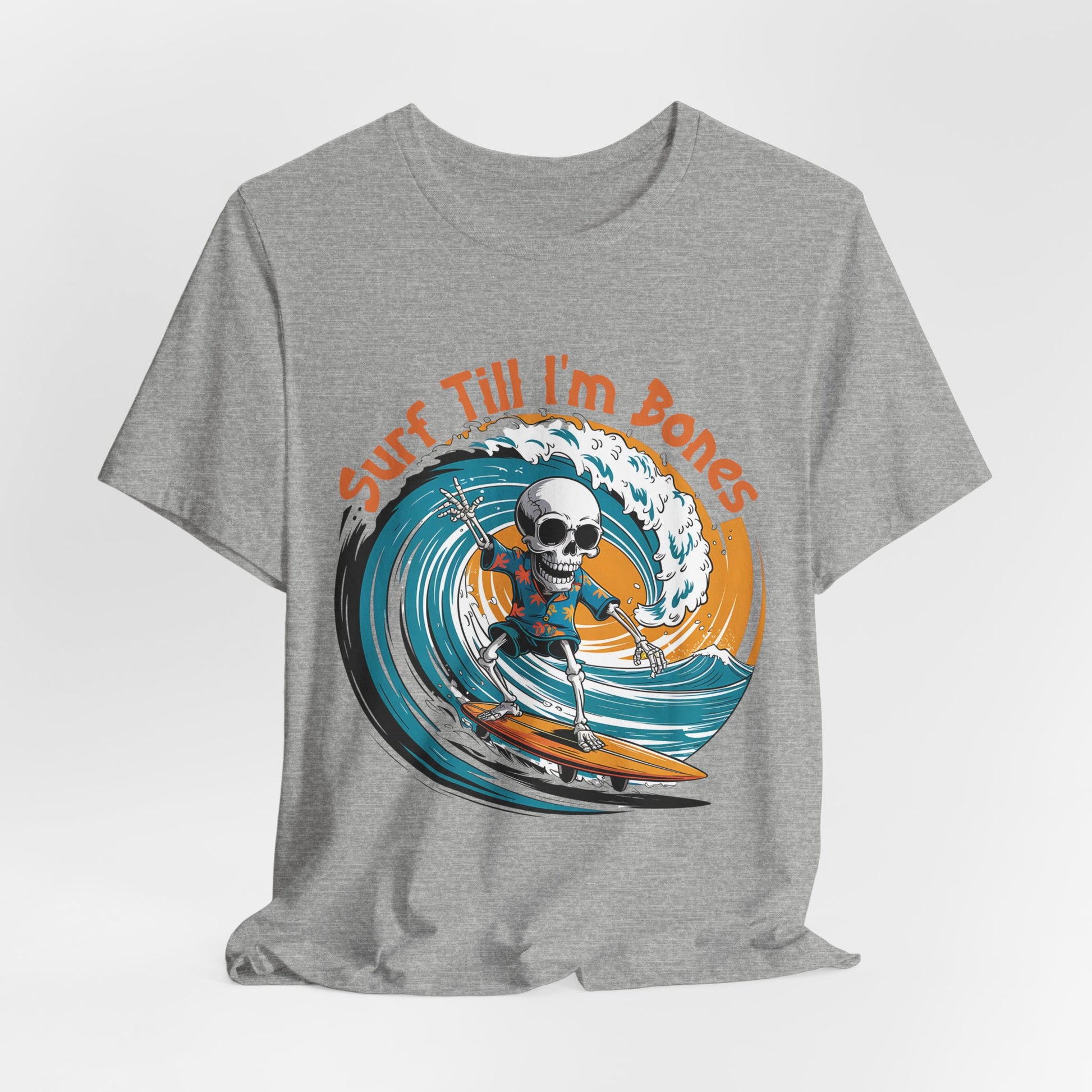 The Surf Till Im Bones Unisex Jersey Tee features a skull surfing a blue wave and orange Surf Till Im Bones text—perfect for beach lovers and anyone seeking a fun, sustainable graphic shirt.