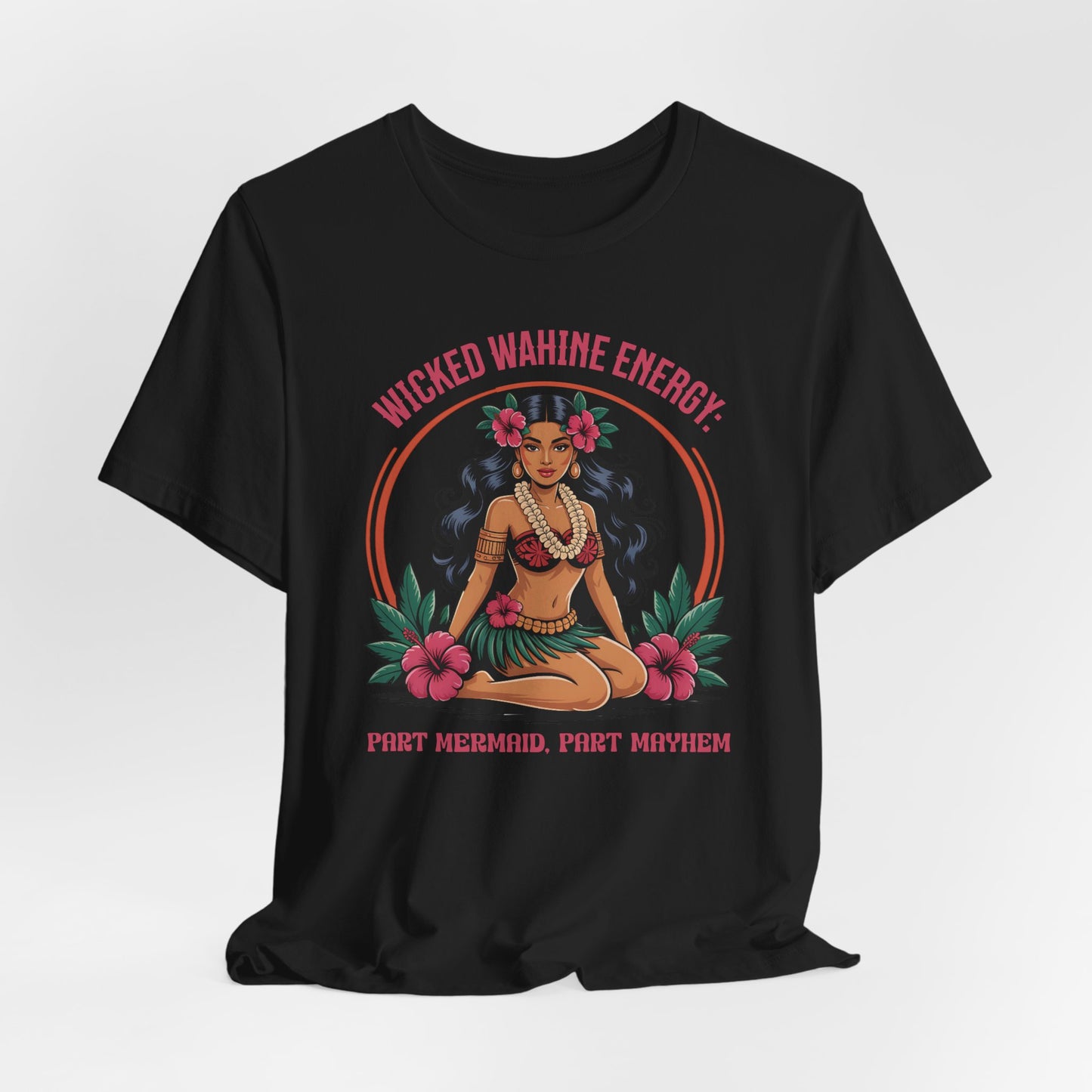 The Wicked Wahine Energy Unisex Tee - Part Mermaid, Part Mayhem features an illustrated woman in a hula-inspired outfit with flowers and leaves—perfect for fantasy lovers who want bold style.