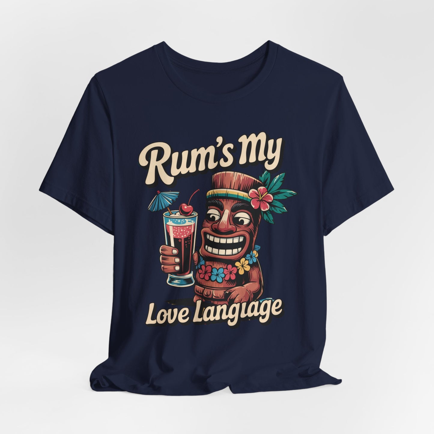 Celebrate tropical vibes in our ‘Rum’s My Love Language’ Unisex Tiki T-Shirt, featuring a colorful tiki with cocktail, flowers, leaves, and a straw hat—perfect for rum lovers and island getaways.