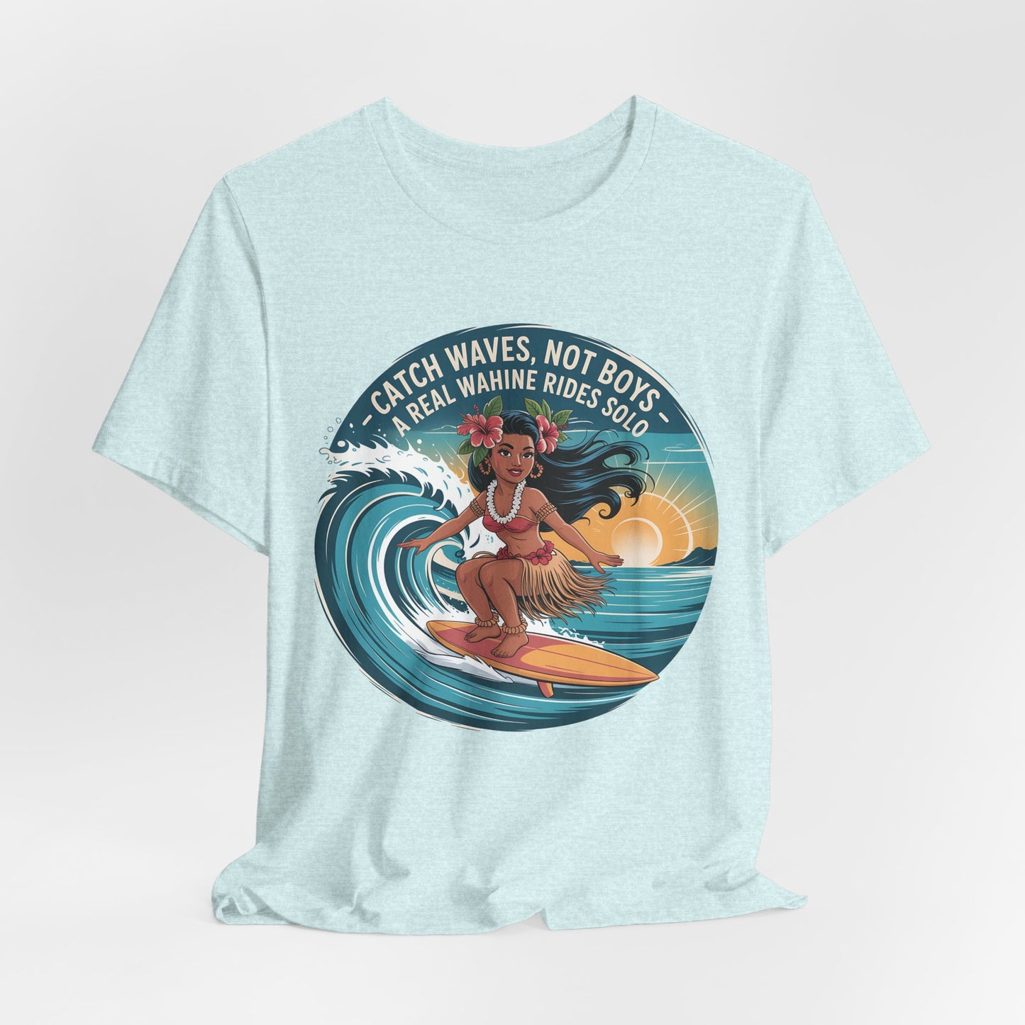 The Catch Waves Not Boys Wahine T-Shirt is a light turquoise tee for beach lovers, featuring a woman surfing at sunset and the phrase Catch waves, not boys. A real wahine rides solo above the graphic.