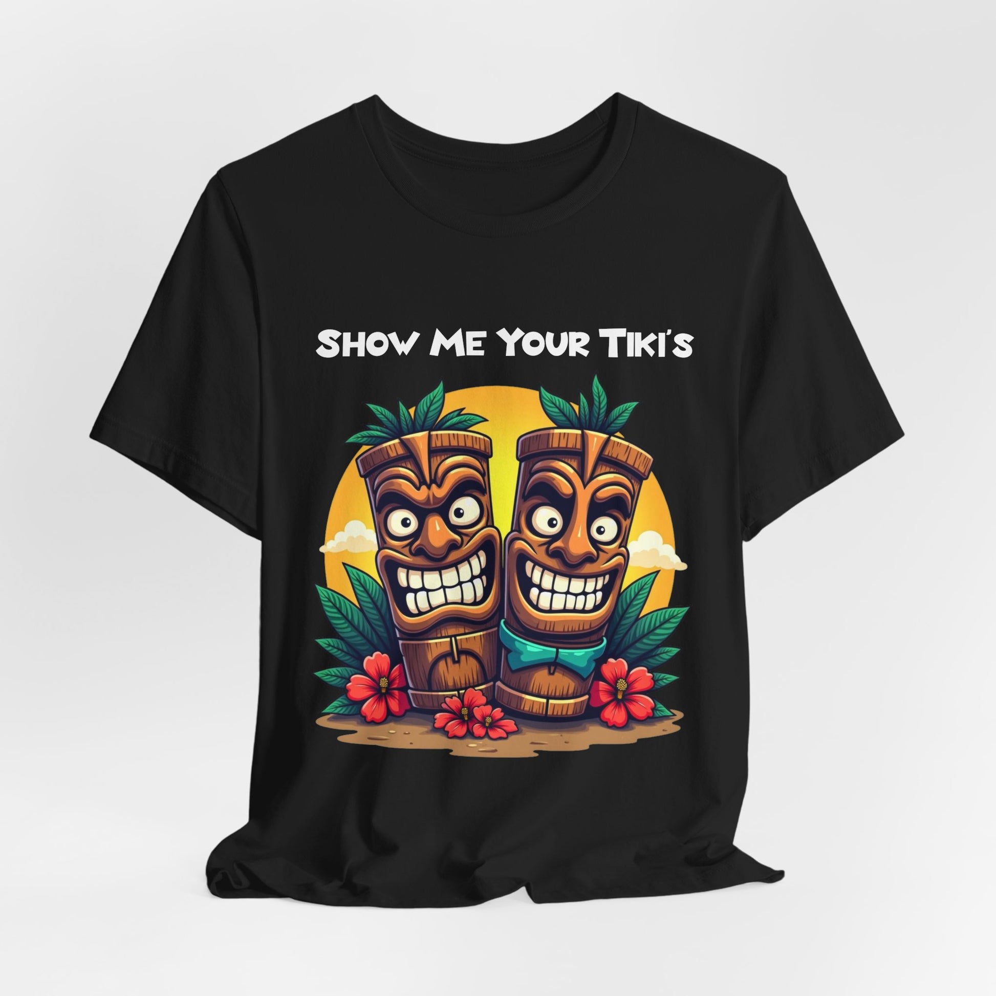 The Tiki Fun Unisex Jersey Short Sleeve Tiki T-Shirt – Show Me Your Tikis Graphic Shirt in black features two smiling tiki statues and a bold SHOW ME YOUR TIKIS text on soft Airlume cotton with a vibrant tropical design.