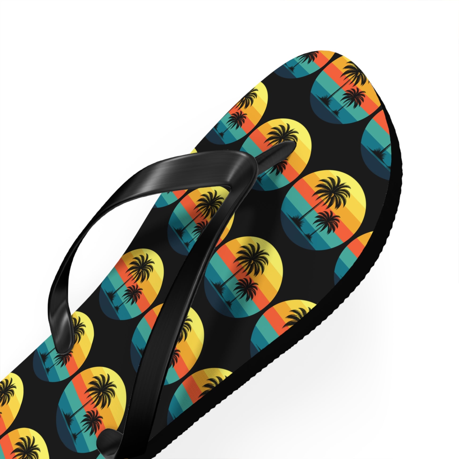 The Tropical Sunset Flip Flops - Summer Vibes with Palm Trees feature black straps and a vivid sunset design with palm trees and ocean waves—perfect for beach lovers wanting to add colorful flair to their summer look.