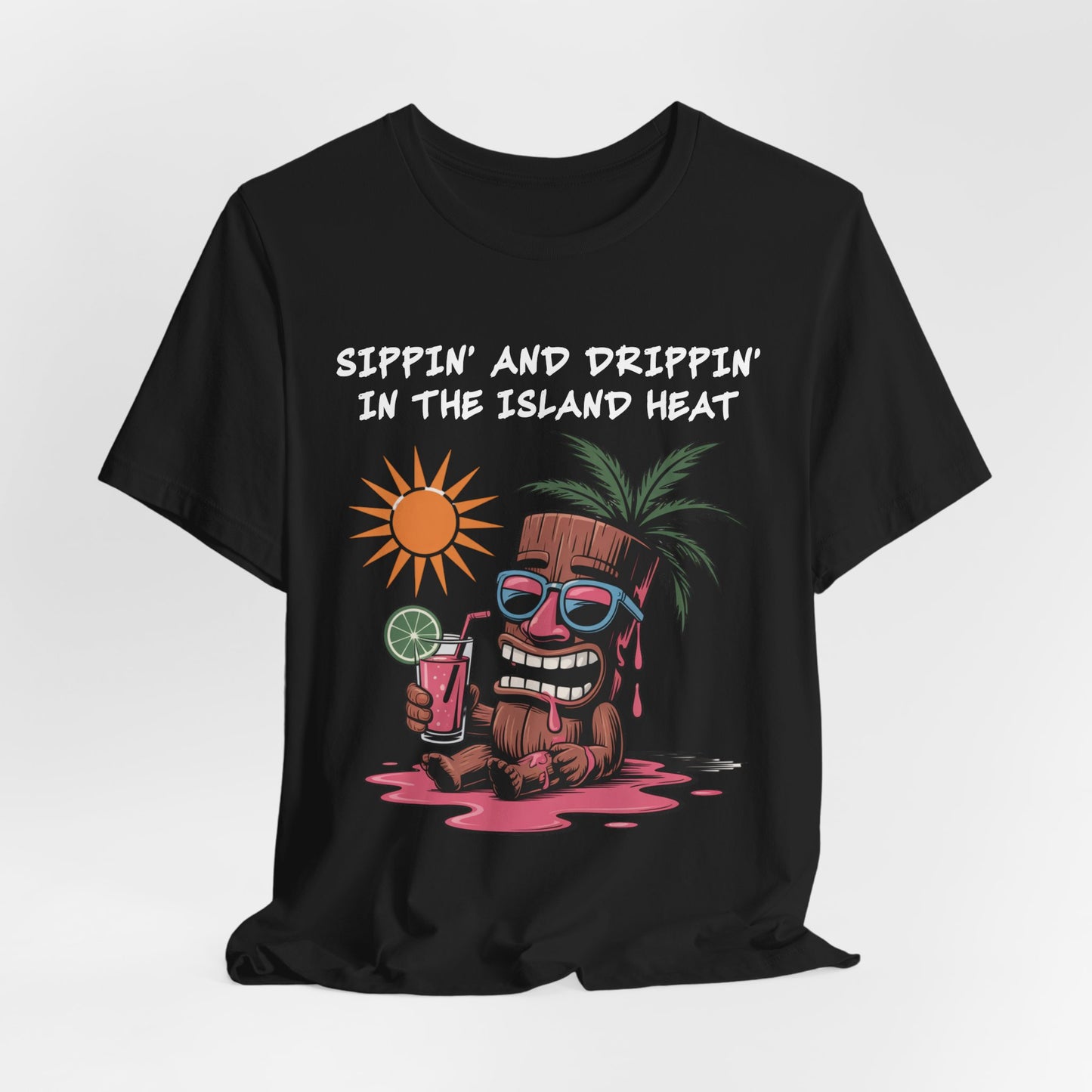 Elevate your style with the Tropical Vibes Tiki T-Shirt—featuring a cartoon tiki in sunglasses, a tropical drink, and “Sippin’ and Drippin’ in the Island Heat” graphic for that perfect island-inspired look.
