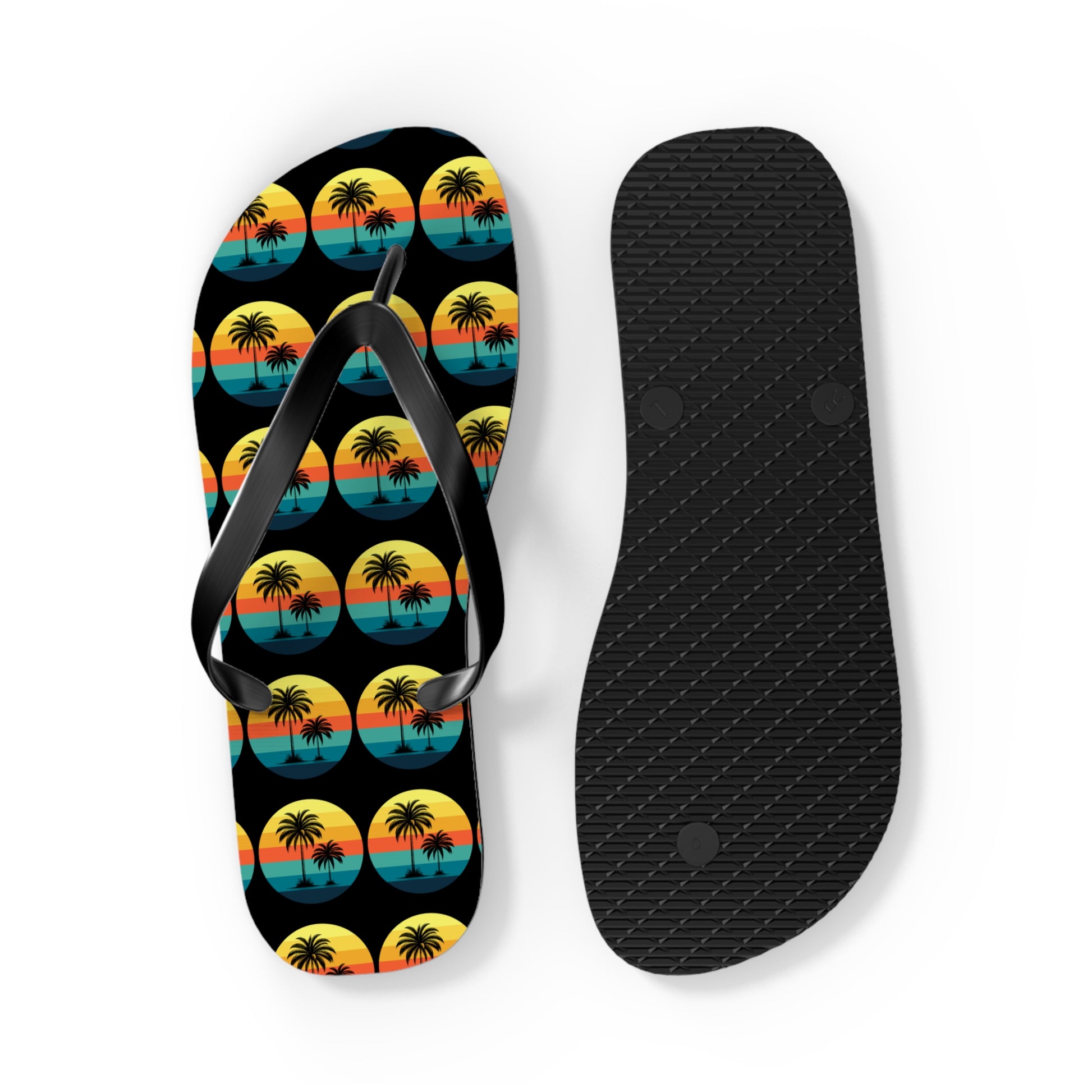 Perfect for beach lovers, the Tropical Sunset Flip Flops - Summer Vibes with Palm Trees feature a colorful sunset and palm design on the left sandal, paired with a black textured sole on the right, both set against a white background.