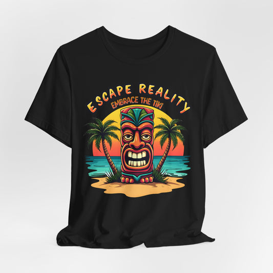 The Escape Reality Unisex Tiki T-Shirt features a colorful tiki head on a beach with palm trees, sunset, and “Escape Reality” and “Embrace the Tiki” text—the perfect sustainable cotton shirt for summer and beach getaways.