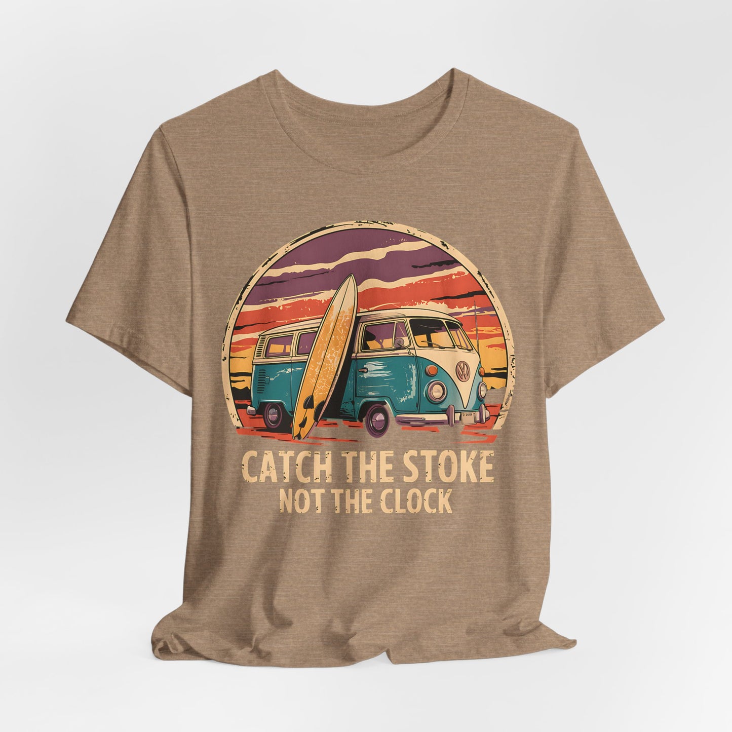The Catch the Stoke Surf Tee - Unisex Jersey Short Sleeve T-Shirt features a tan color and a retro graphic of a teal and cream van with a surfboard at sunset, plus the bold motto CATCH THE STOKE NOT THE CLOCK in vintage style.