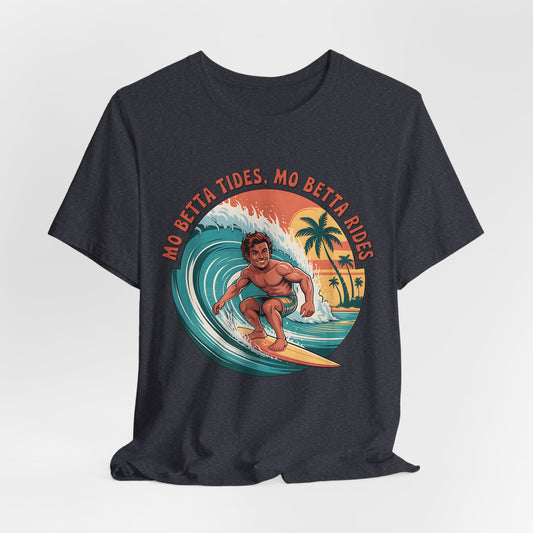 The Surfing Graphic T-Shirt - Mo Betta Tides, Mo Betta Rides showcases a smiling surfer riding a wave with palm trees and a sunset backdrop. Bold orange text above reads MO BETTA TIDES, MO BETTA RIDES. Ideal for beach holidays or summer getaways.