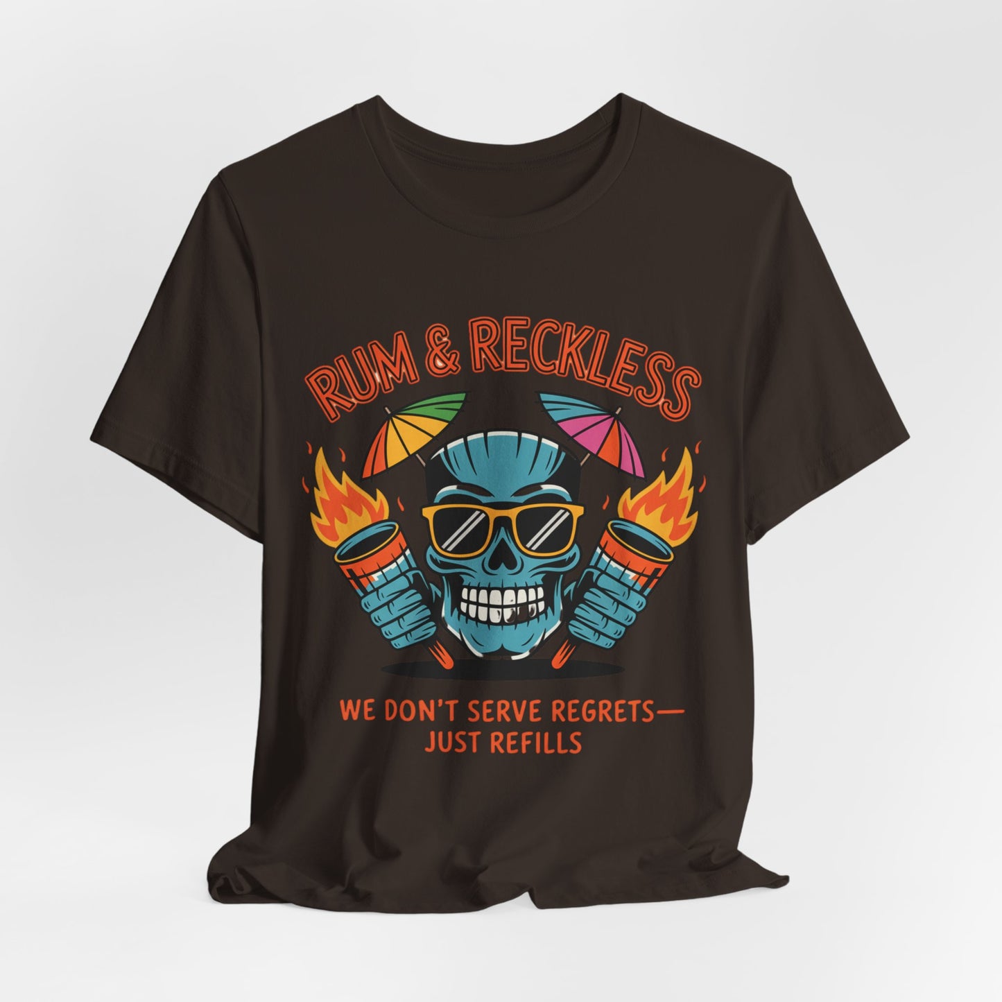 The Rum & Reckless Skull Tiki T-Shirt is a black unisex tee featuring a blue skull in sunglasses with flaming drinks, plus “RUM & RECKLESS” and “WE DON’T SERVE REGRETS — JUST REFILLS.” Perfect for summer parties and beach days!.