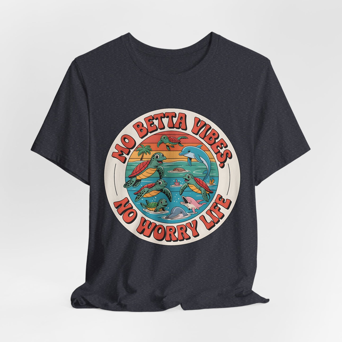 The Mo Betta Vibes Unisex Jersey T-Shirt is a dark, relaxed fit summer graphic shirt with a colorful retro circle of turtles, dolphins, and waves, plus the positive message Mo Betta Vibes, No Worry Life in bold red—perfect for casual wear.