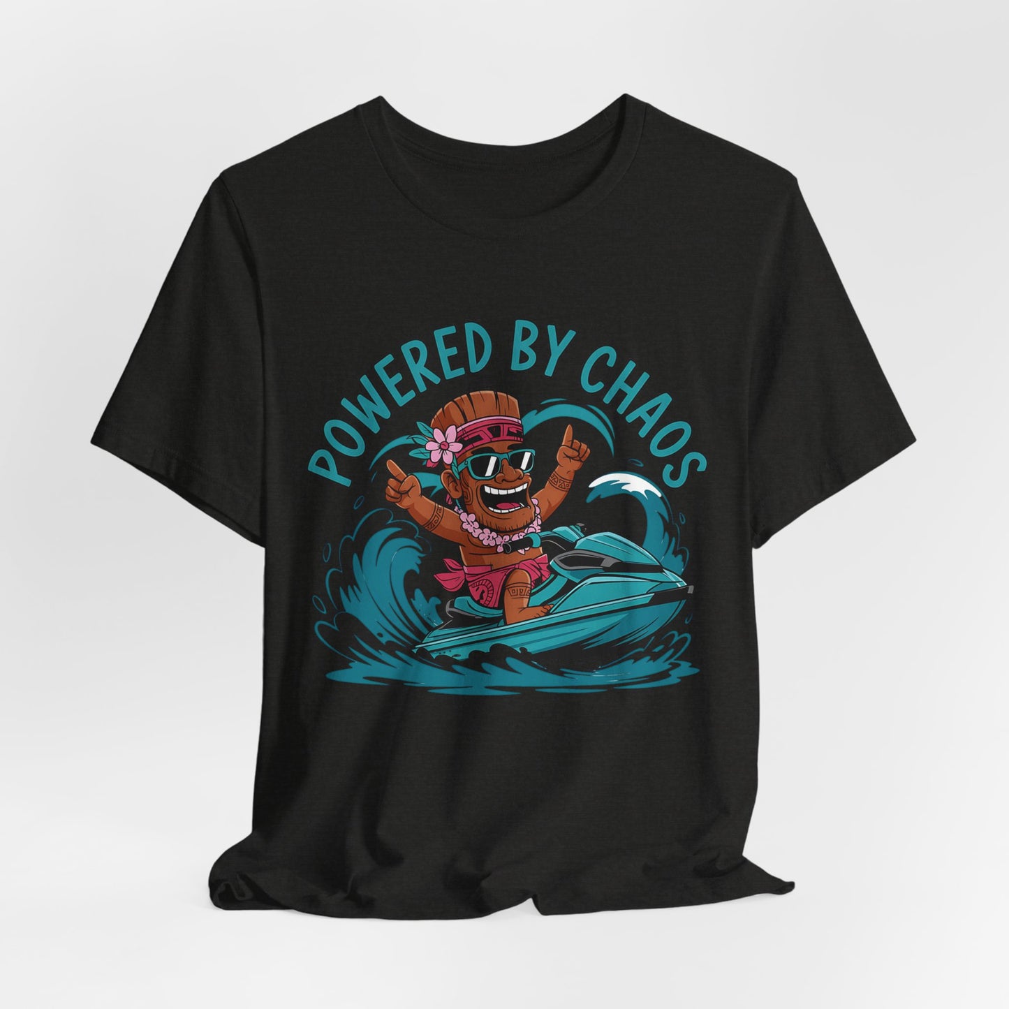 The Powered by Chaos Unisex Jersey Tiki T-Shirt showcases a cartoon in sunglasses and flower lei on a jet ski, riding blue waves. Crafted from breathable cotton, Powered by Chaos is printed in bold teal above for a fun summer look.