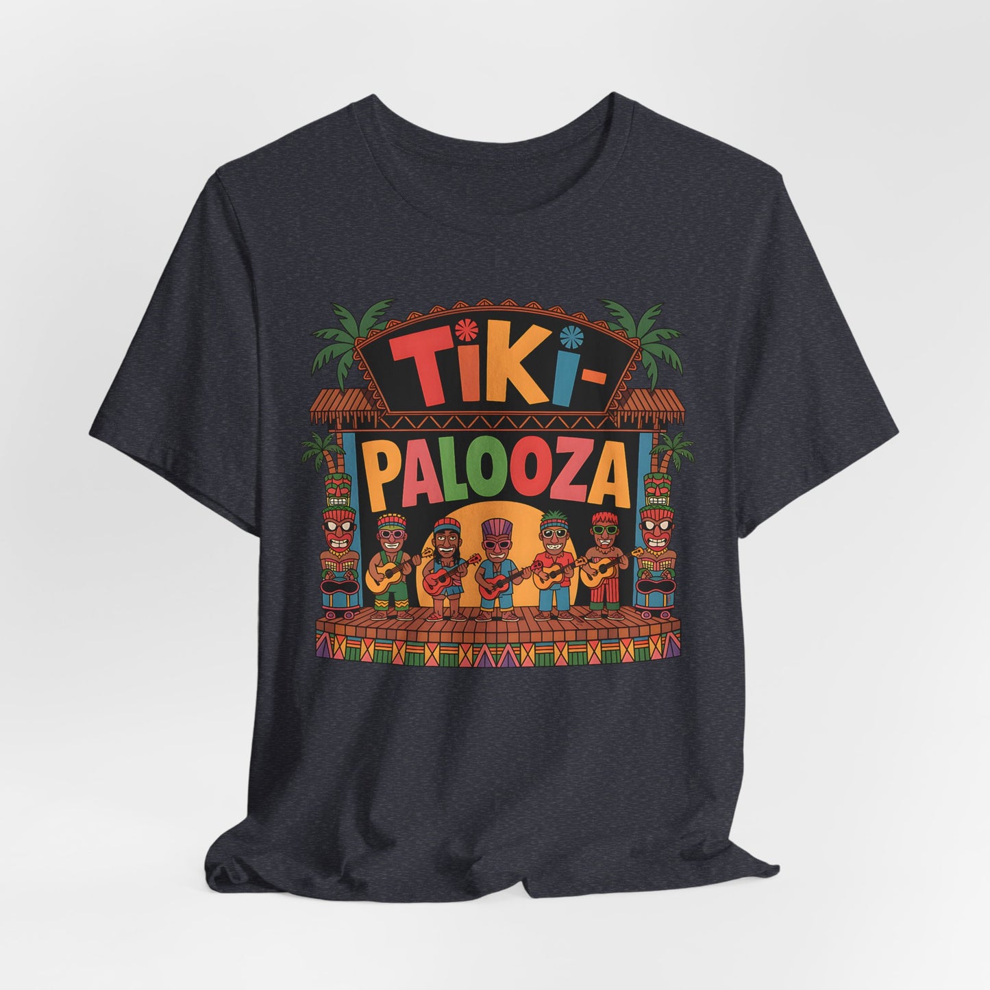 The Tiki Palooza Unisex Jersey Tiki T-Shirt features a festive floral graphic with tropical huts, palm trees, tiki statues, and cartoon musicians—perfect for summer parties and island vibes!.