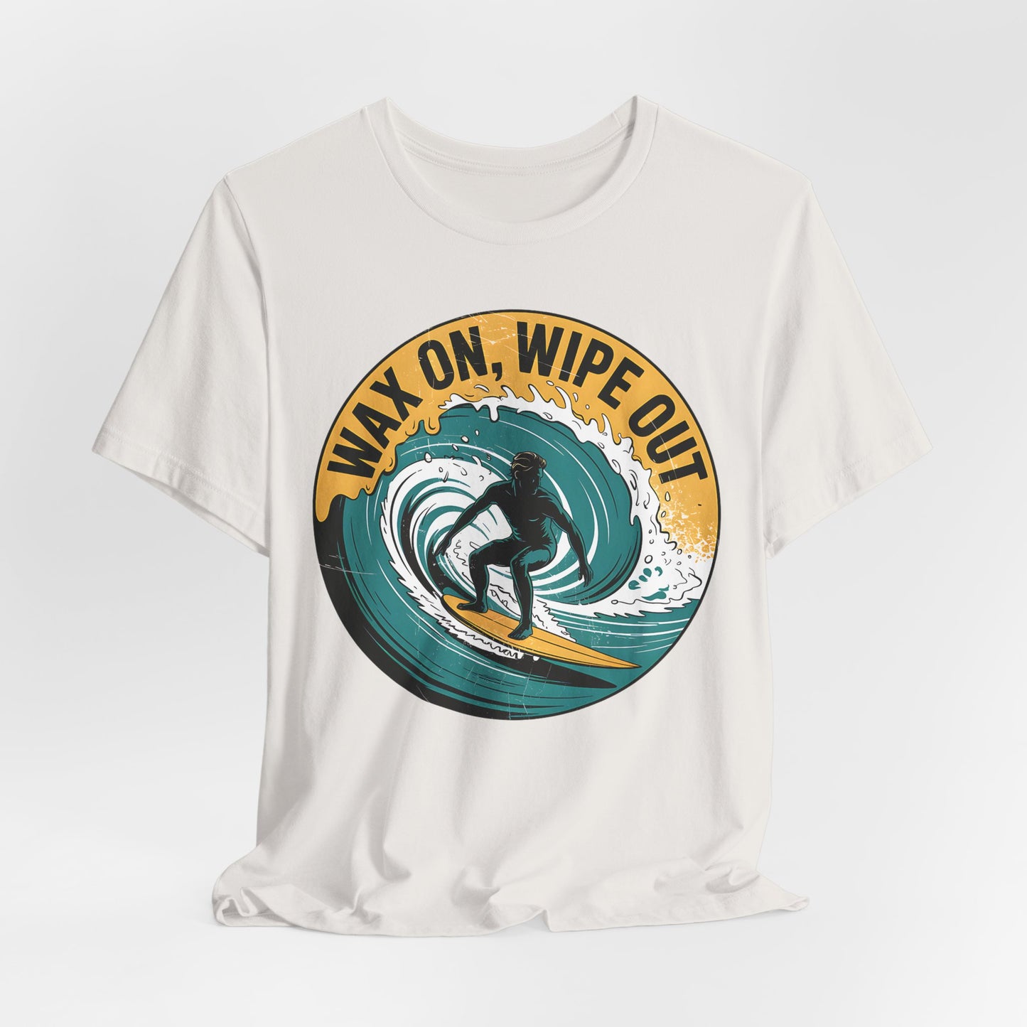 Perfect for surf and beach fans, the Surfing Inspired Unisex Short Sleeve T-Shirt features a bold WAX ON, WIPE OUT design with a graphic of a surfer riding a giant wave.