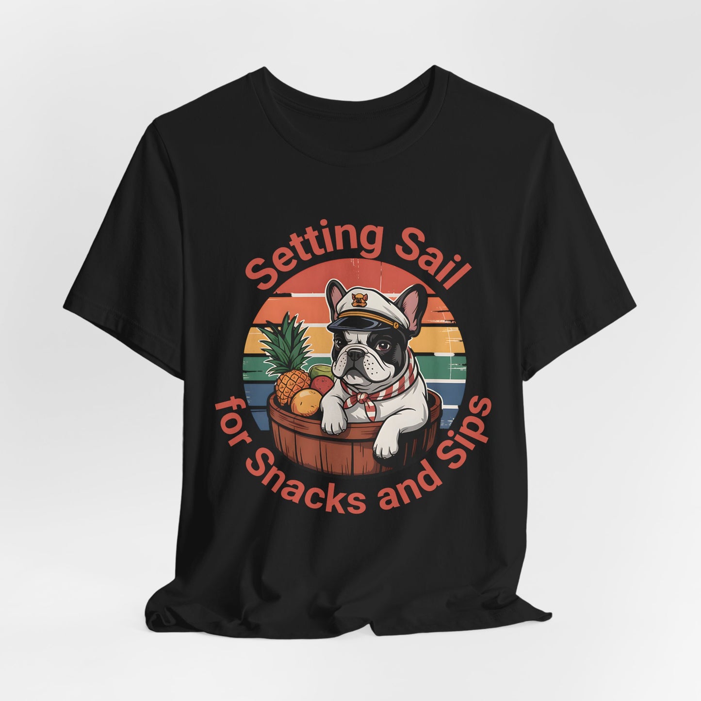 Ideal for dog and beach lovers, the Setting Sail for Snacks and Sips T-Shirt features a cartoon French bulldog in a captain’s hat with tropical fruits, sunset background, and the saying: “Setting Sail for Snacks and Sips.” Unisex fit.
