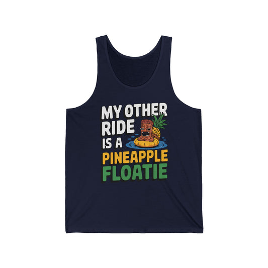 The Pineapple Floatie Unisex Jersey Tank Top features MY OTHER RIDE IS A PINEAPPLE FLOATIE and a cartoon tiki head on a pineapple pool float—perfect for casual wear and summer vibes.