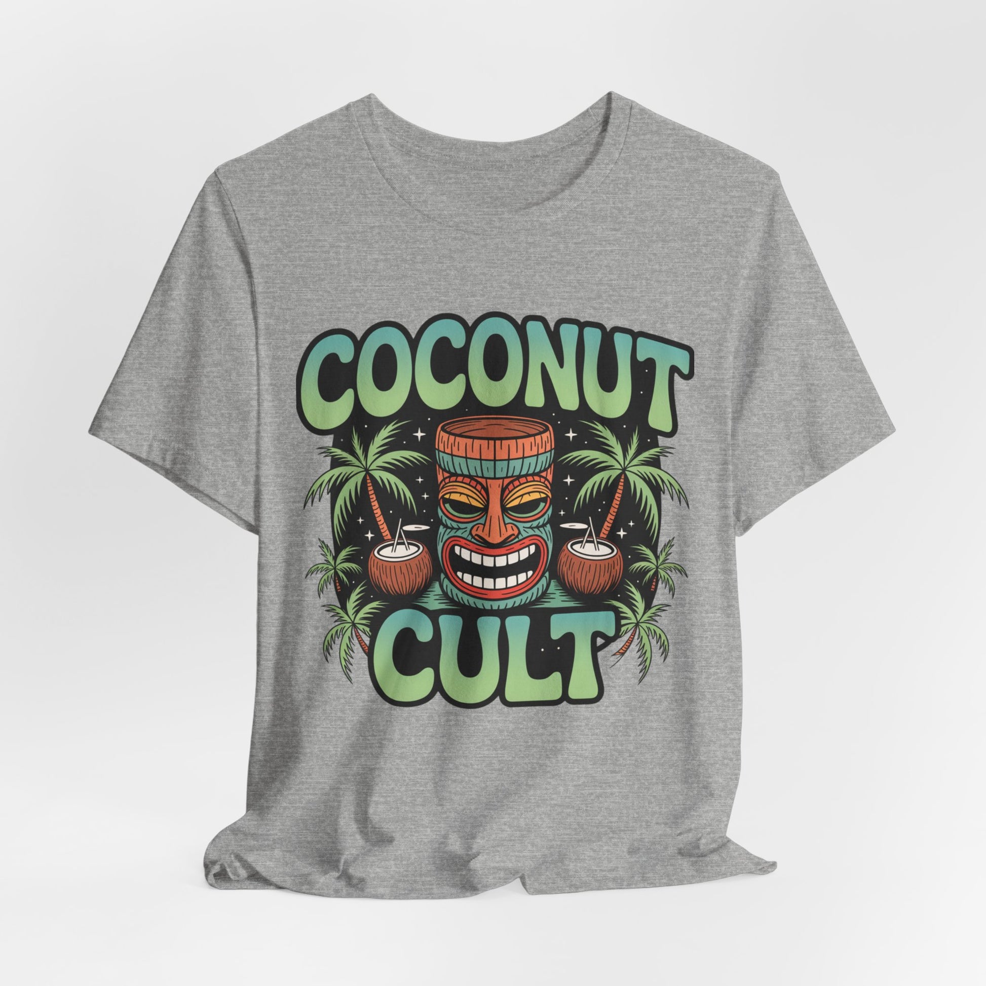 The Coconut Cult Unisex Jersey Tiki T-Shirt features a vibrant tiki face, coconuts, and palm trees on soft gray Airlume Cotton—perfect tropical vibes for beach lovers!.