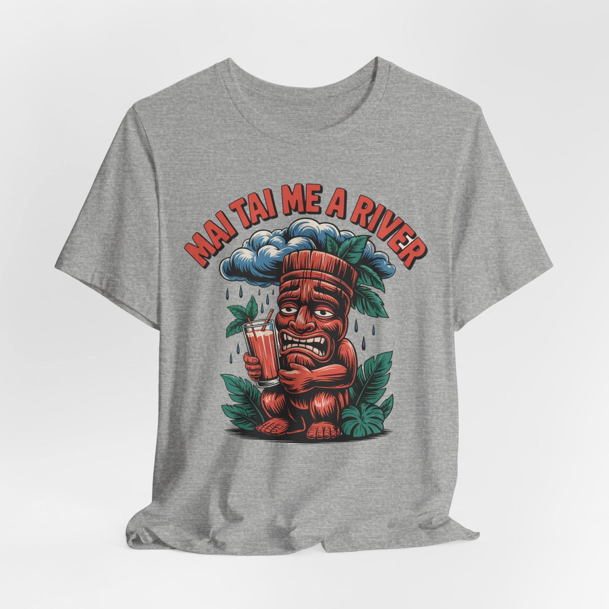 The Mai Tai Me a River Tropical Tiki T-Shirt features a cartoon tiki with a drink under a rain cloud, plus bold MAI TAI ME A RIVER text for a playful tropical look.