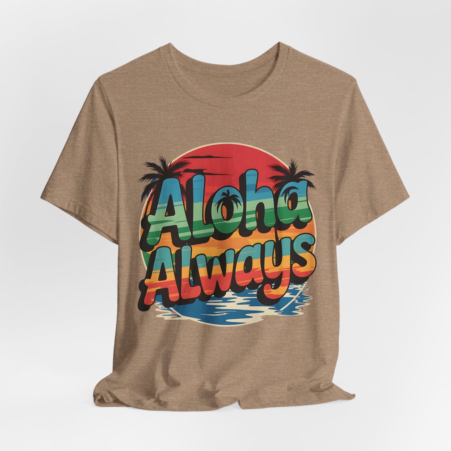  T-Shirt is a tan unisex short sleeve shirt featuring a vibrant sunset, palm trees, water, and Aloha Always in bold gradient letters—ideal for beach lovers embracing island vibes.