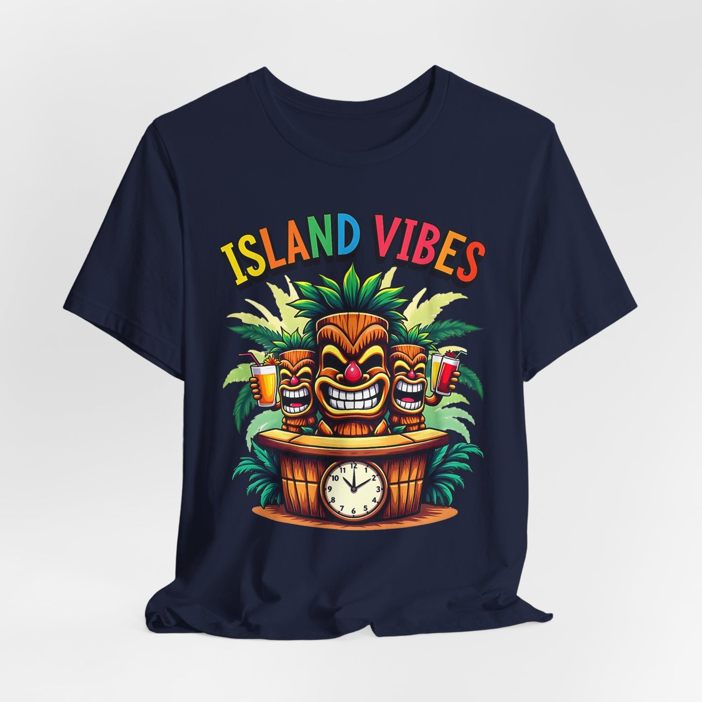 Island Vibes Tiki T-Shirt - Unisex Relaxed Fit features colorful ISLAND VIBES text, three smiling tiki masks, palm leaves, two drinks, and a clock on a bar—perfect for tropical lovers and beach vibes enthusiasts.