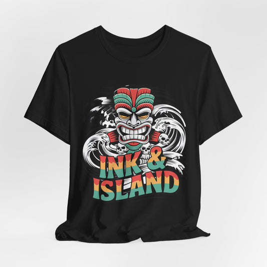 The Tropical Ink & Island Unisex Tiki T-Shirt showcases a vibrant tiki mask, bold waves, and multicolor Ink & Island text—perfect summer vibes and beachwear for those who love island culture.