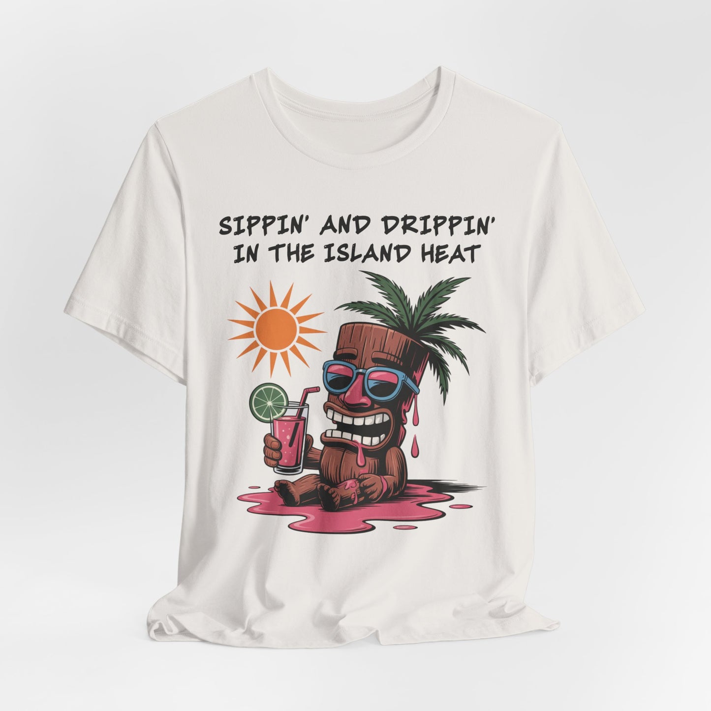 The Tropical Vibes Tiki T-Shirt - Sippin and Drippin in the Island Heat is a lightweight, unisex tee featuring a cartoon coconut with sunglasses, palm tree, and pink drink—perfect for island vibes.