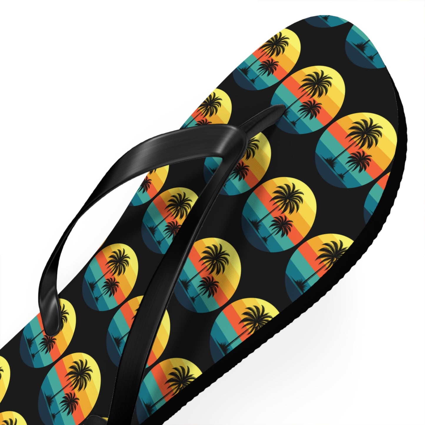 The Tropical Sunset Flip Flops feature palm trees, orange-yellow skies, and blue water in repeating circles—perfect for beach lovers wanting to refresh their summer style.