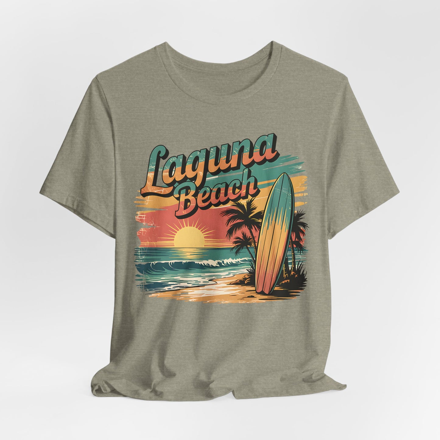 The Laguna Beach Surf Tee - Unisex Jersey Short Sleeve Shirt for Beach Lovers features a gray design with a vibrant sunset, ocean waves, palm trees, surfboard graphic, and retro “Laguna Beach” lettering—perfect for beach fans.