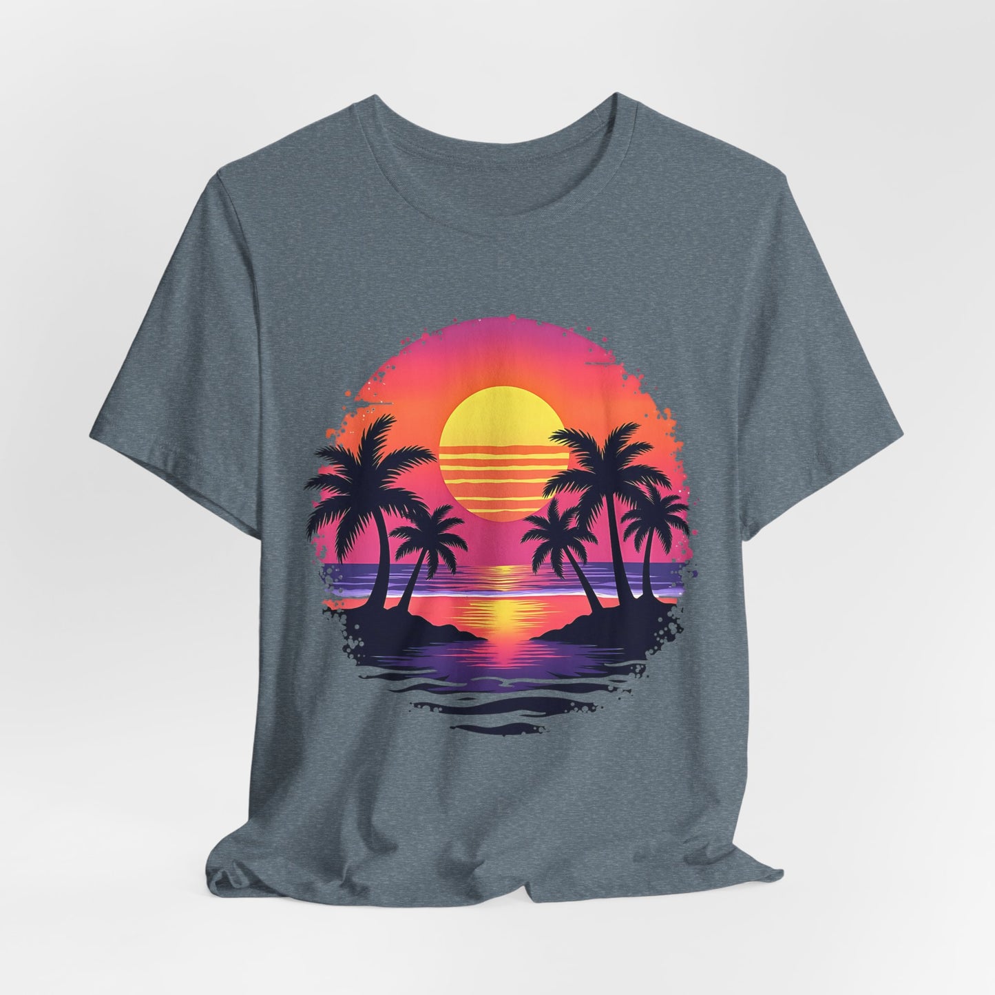 The Tropical Sunset Graphic T-Shirt is a unisex jersey short sleeve shirt, made from soft Airlume cotton, featuring a vibrant palm tree sunset design perfect for summer vibes.