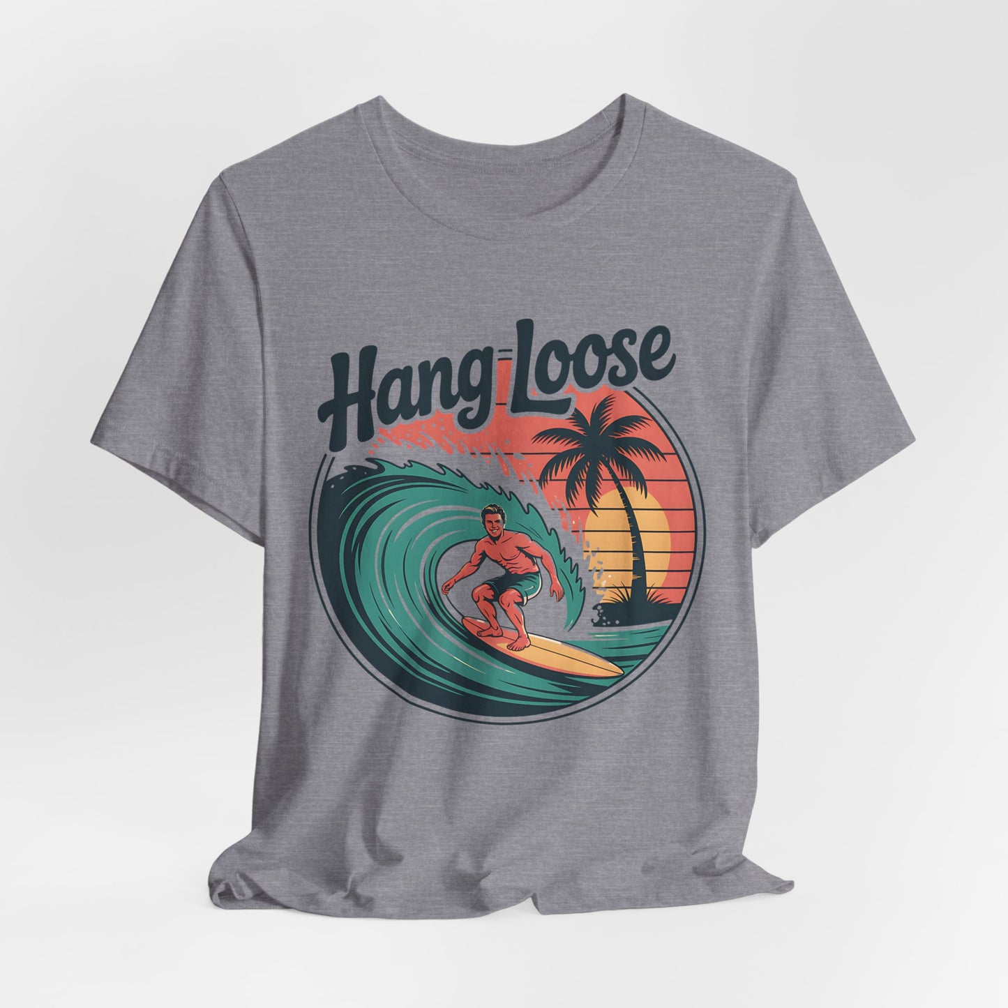 The Hang Loose Unisex Surf T-Shirt - Retro Beach Vibes Shirt features soft Airlume cotton and a graphic of a man surfing at sunset with palm trees and Hang Loose above—ideal for embracing the beach lifestyle.