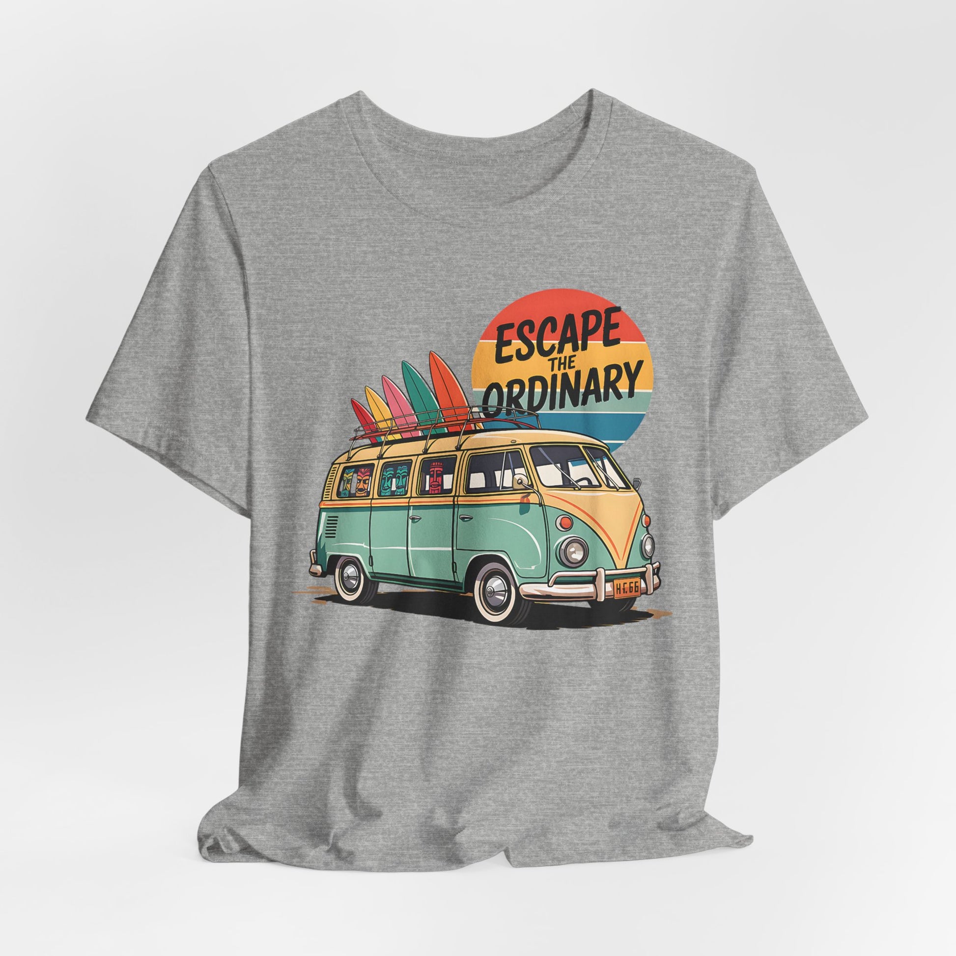 The Escape the Ordinary Surf Tee is a unisex jersey short sleeve shirt with a retro van, surfboards, and a colorful sunset. “Escape the Ordinary” headlines the design, making it perfect for summer festivals and adventure lovers.