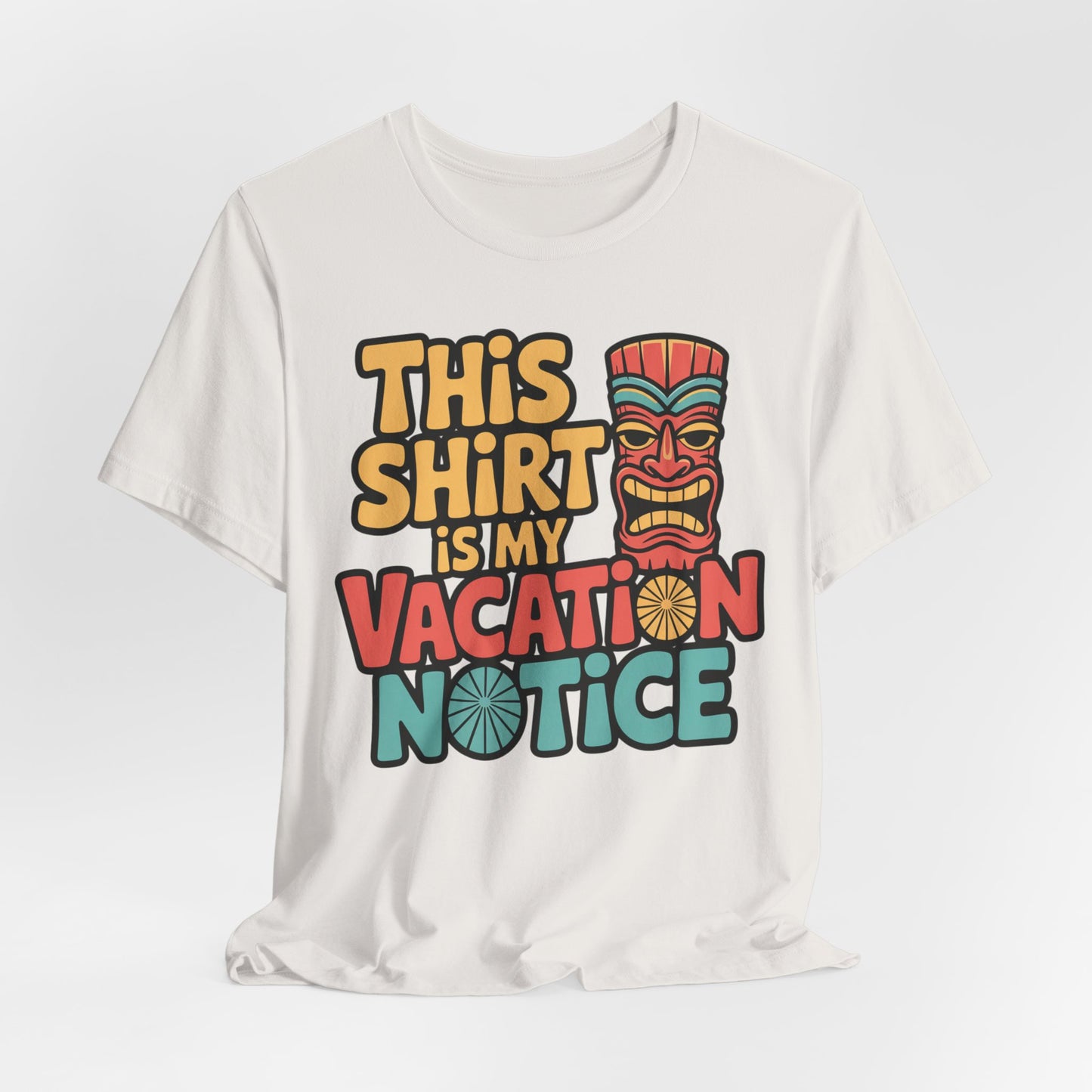 The Tiki T-Shirt - This Shirt is My Vacation Notice features bold, colorful text and a tiki mask on a white unisex eco-friendly tee—perfect for showing your vacation spirit with sustainable style.