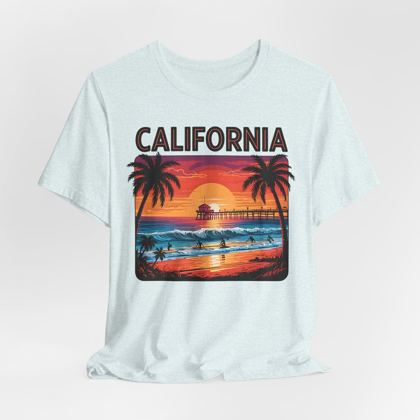 The California Sunset Unisex Jersey T-Shirt - Vintage Beach Vibe features a vibrant sunset beach scene with palm trees, surfers, a pier, and bold CALIFORNIA—perfect for beach lovers and fans of casual fashion.
