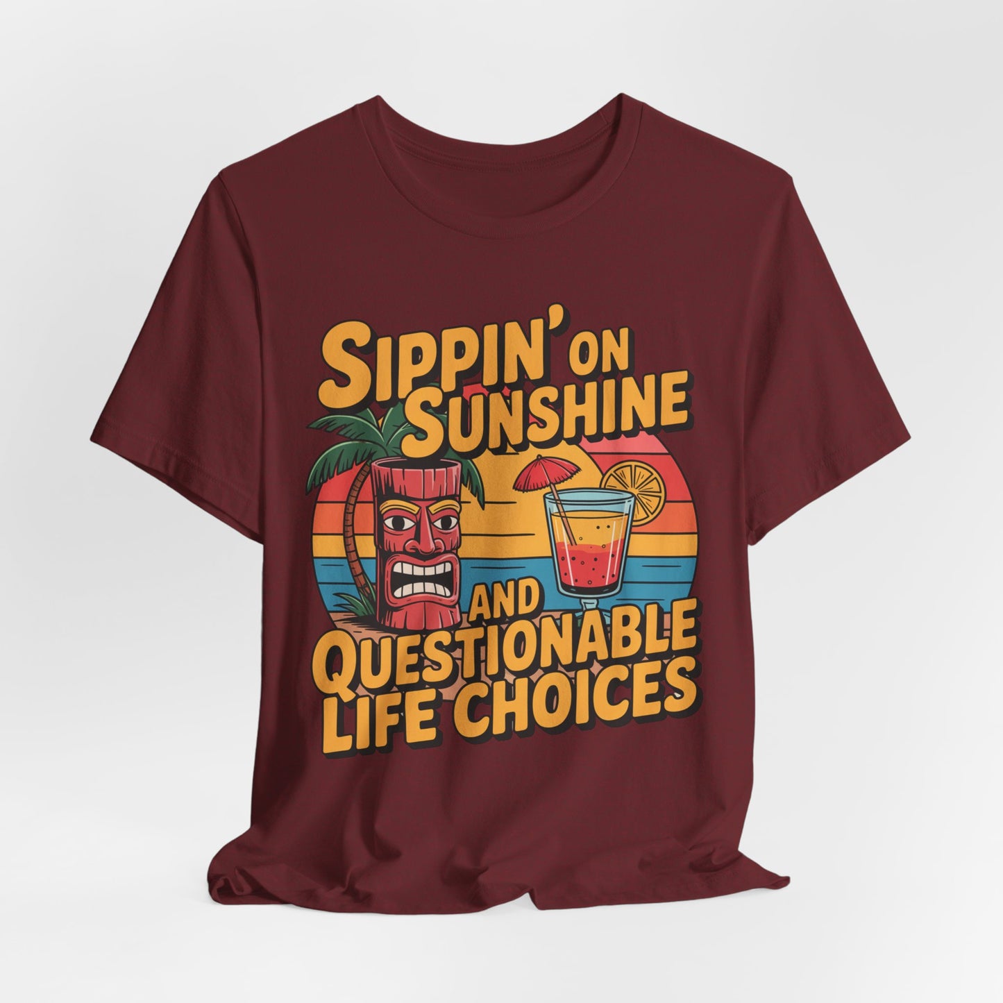 The Sippin on Sunshine Tiki T-Shirt is a maroon unisex jersey featuring a tiki mug, palm tree, cocktail, and “Sippin’ on sunshine and questionable life choices”—a fun retro shirt for beach lovers.